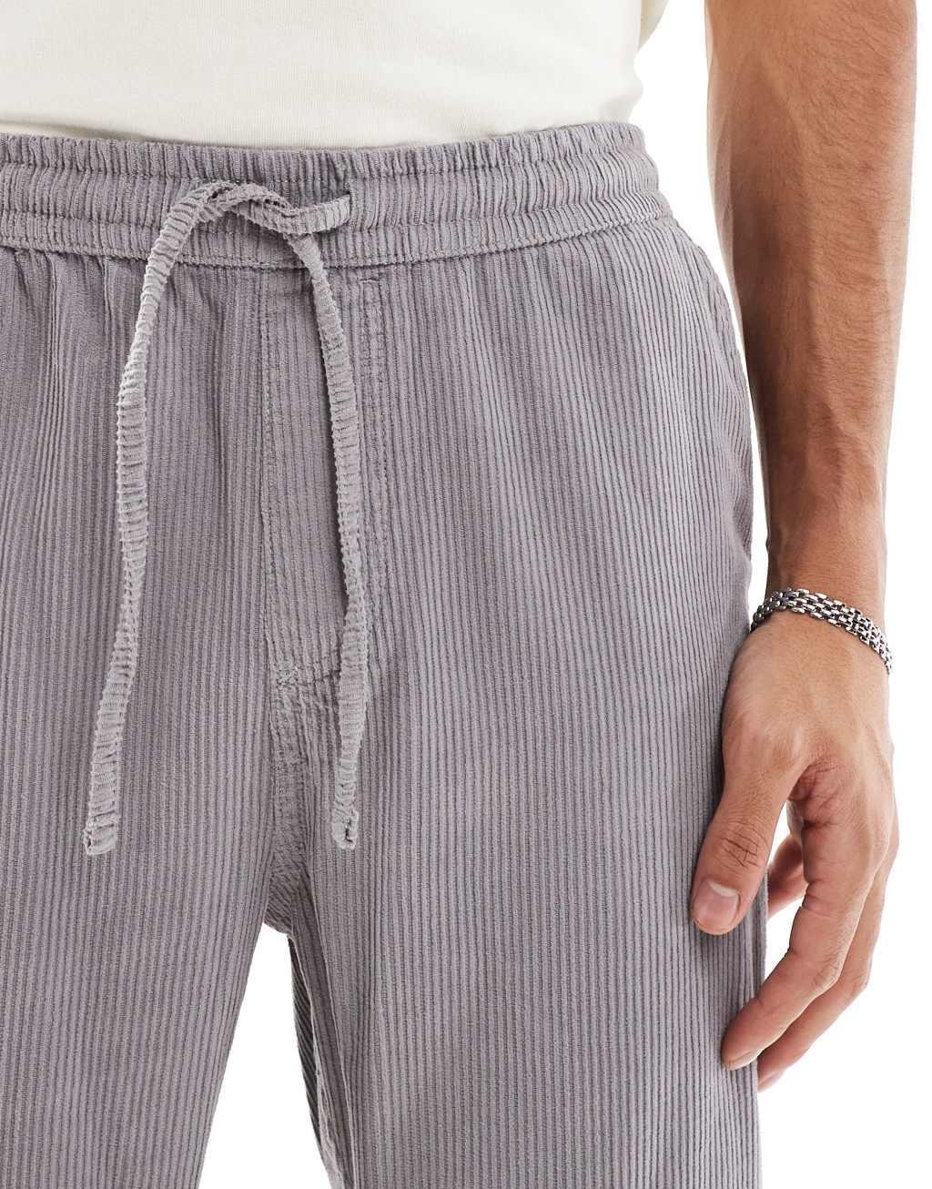 ASOS DESIGN tapered washed cord sweatpants in gray Product Image