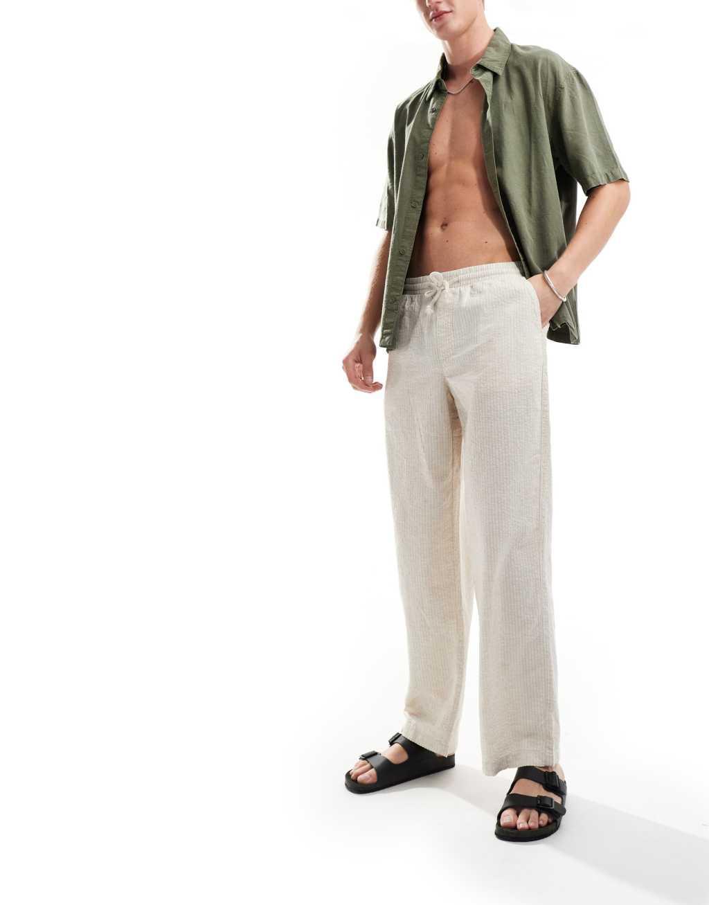 ASOS DESIGN wide linen mix seersucker pants in white stripe Product Image