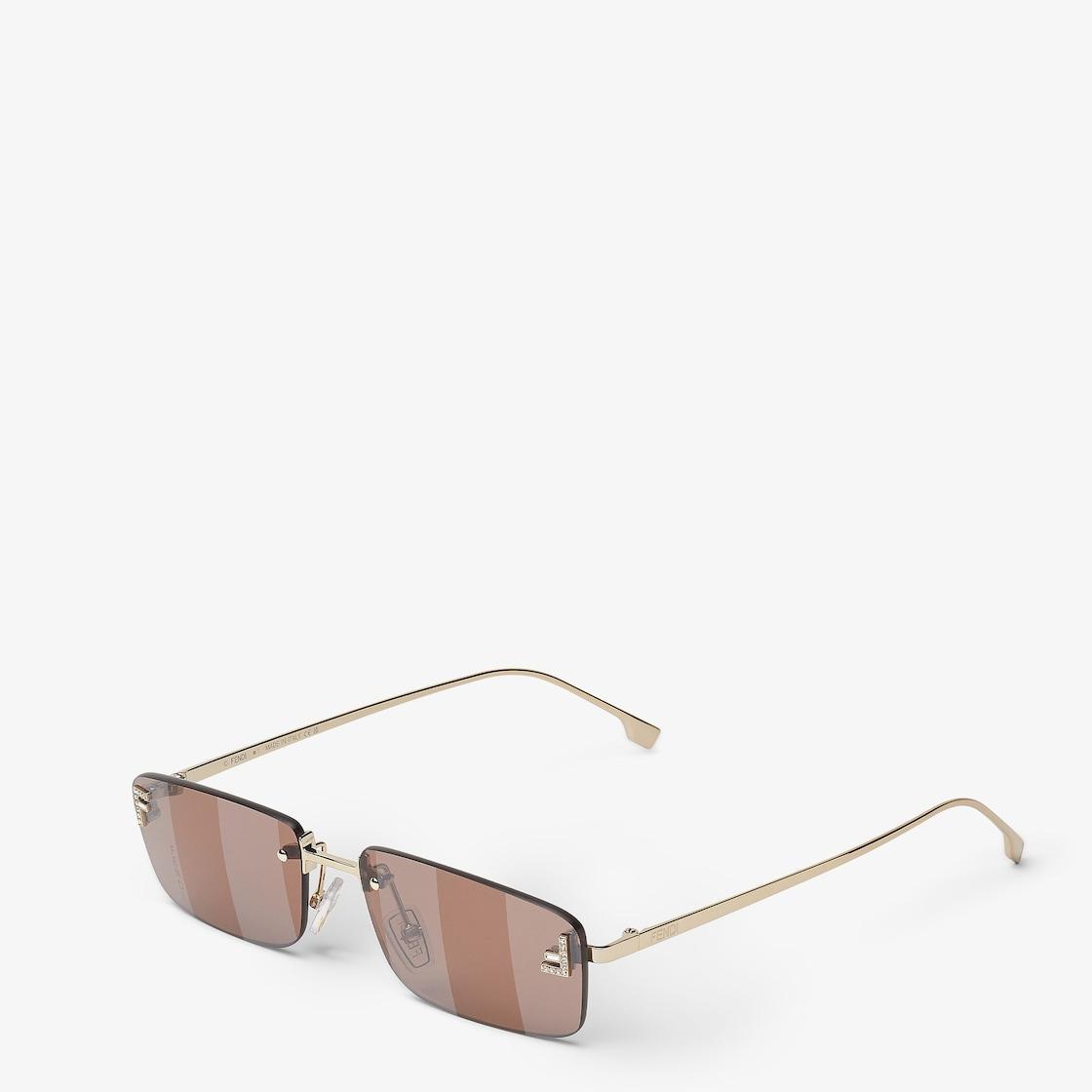 Fendi First CrystalGold-colored sunglasses with rust-colored lenses Product Image