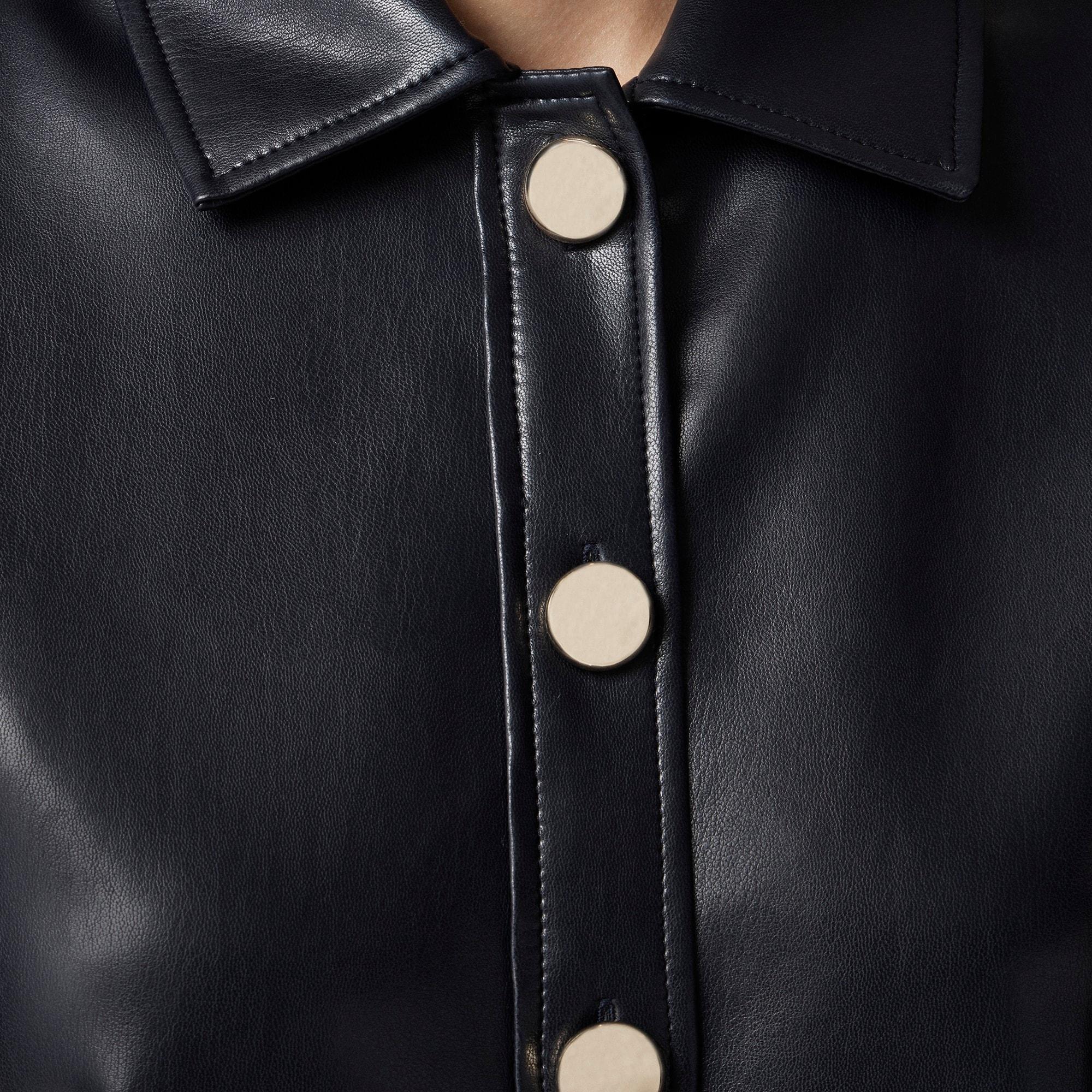 Collection gamine shirt with oversized buttons in faux leather Product Image