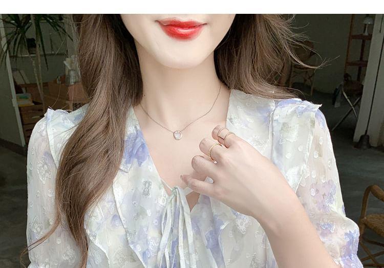 Short-Sleeve V-Neck Patterned Print Ruffle Blouse Product Image
