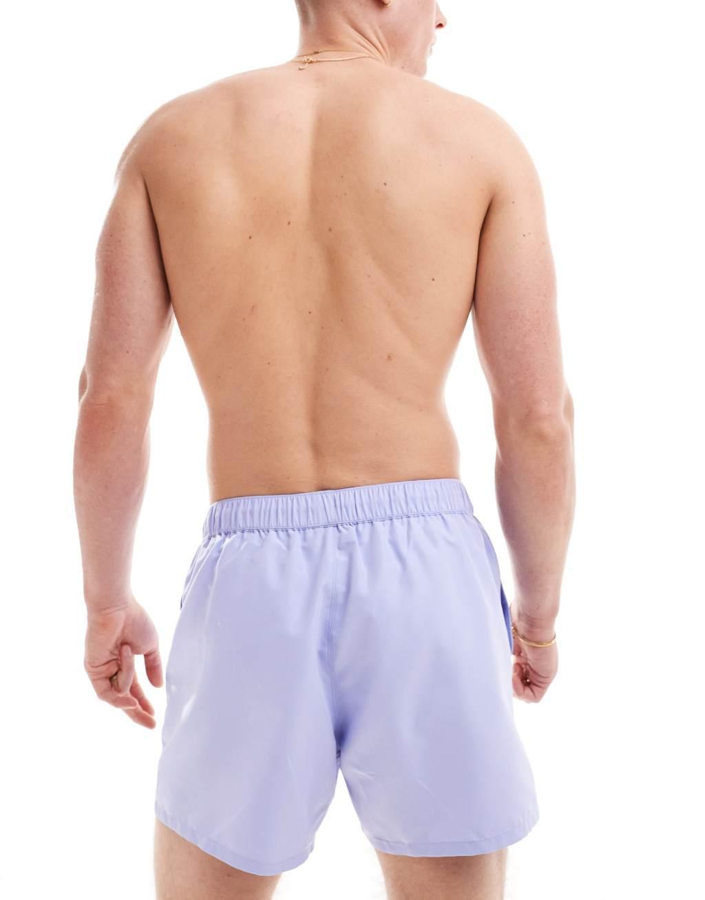 ASOS DESIGN swim shorts in short length in purple Product Image