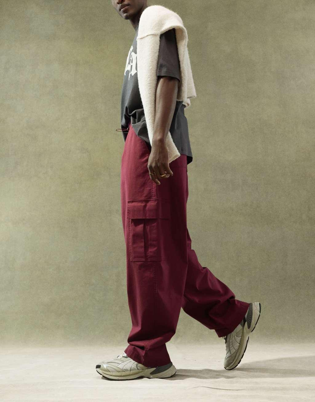 ASOS DESIGN super baggy cargo pants with elastic waist in burgundy Product Image