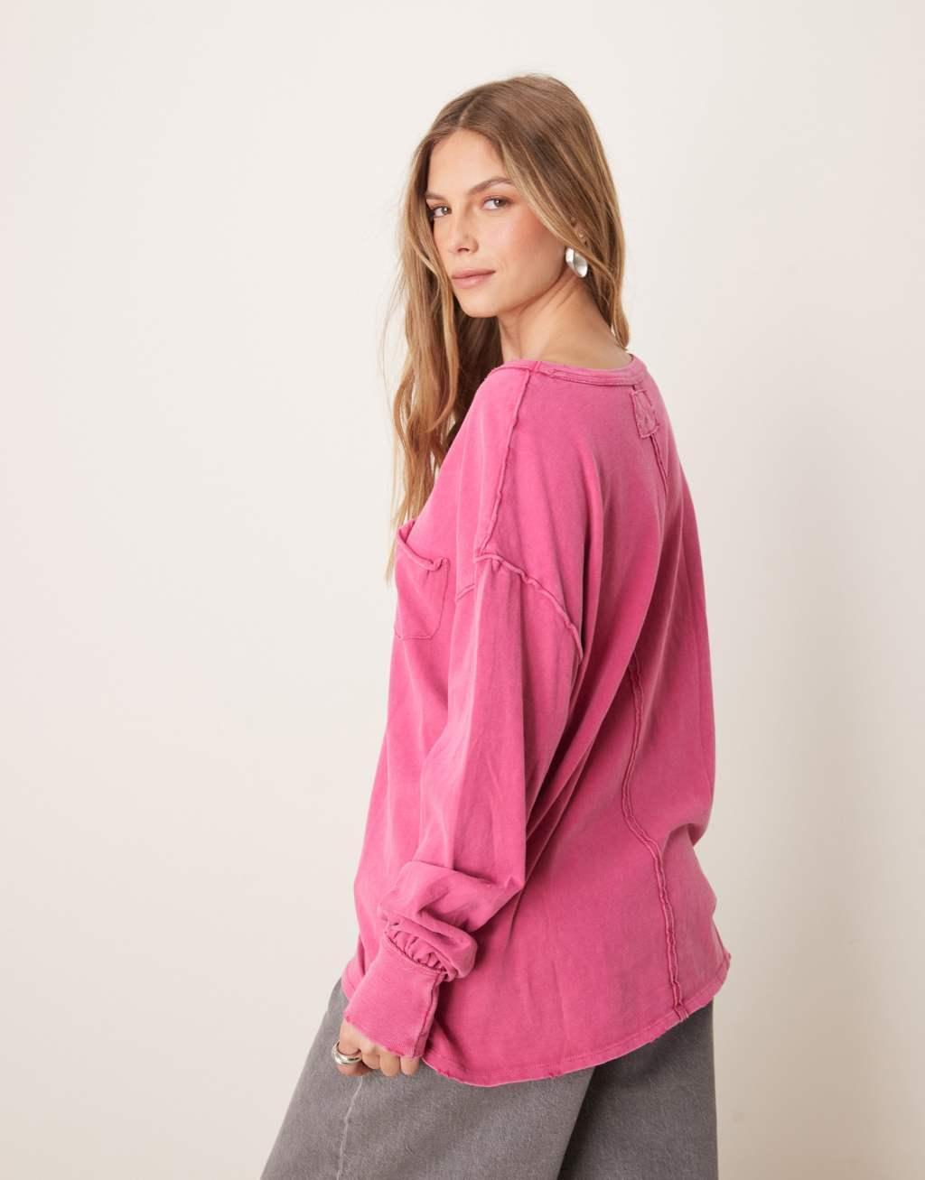 Free People fade into you relaxed long sleeve top in pink Product Image