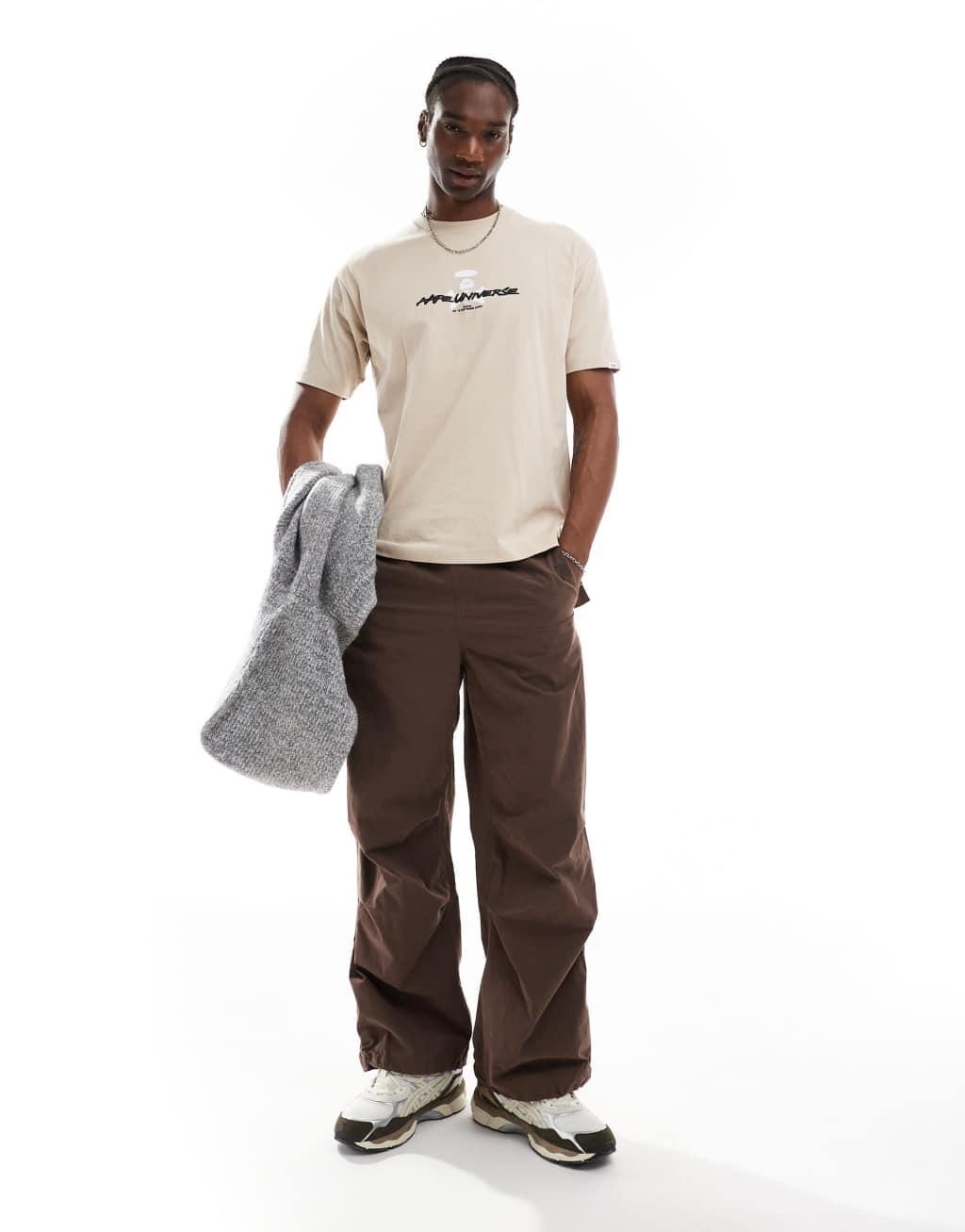 Aape By A Bathing Ape logo t-shirt with camo back print in beige Product Image