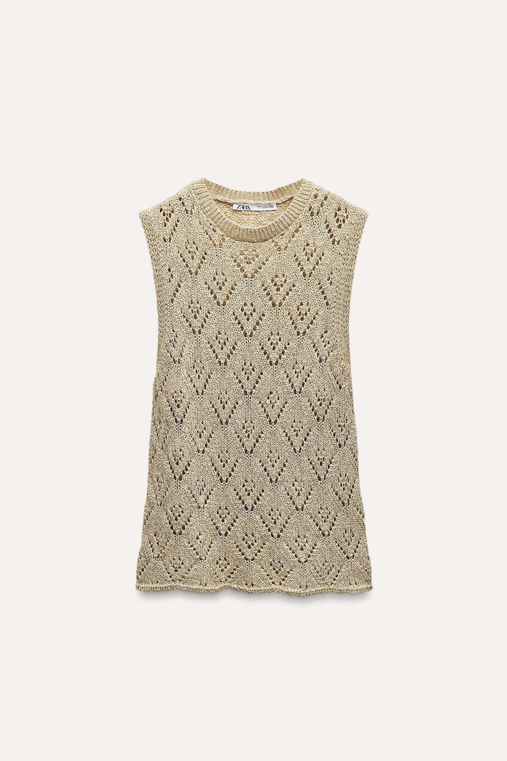 Round neck halter top. Knit fabric with openings and metallic thread. Product Image