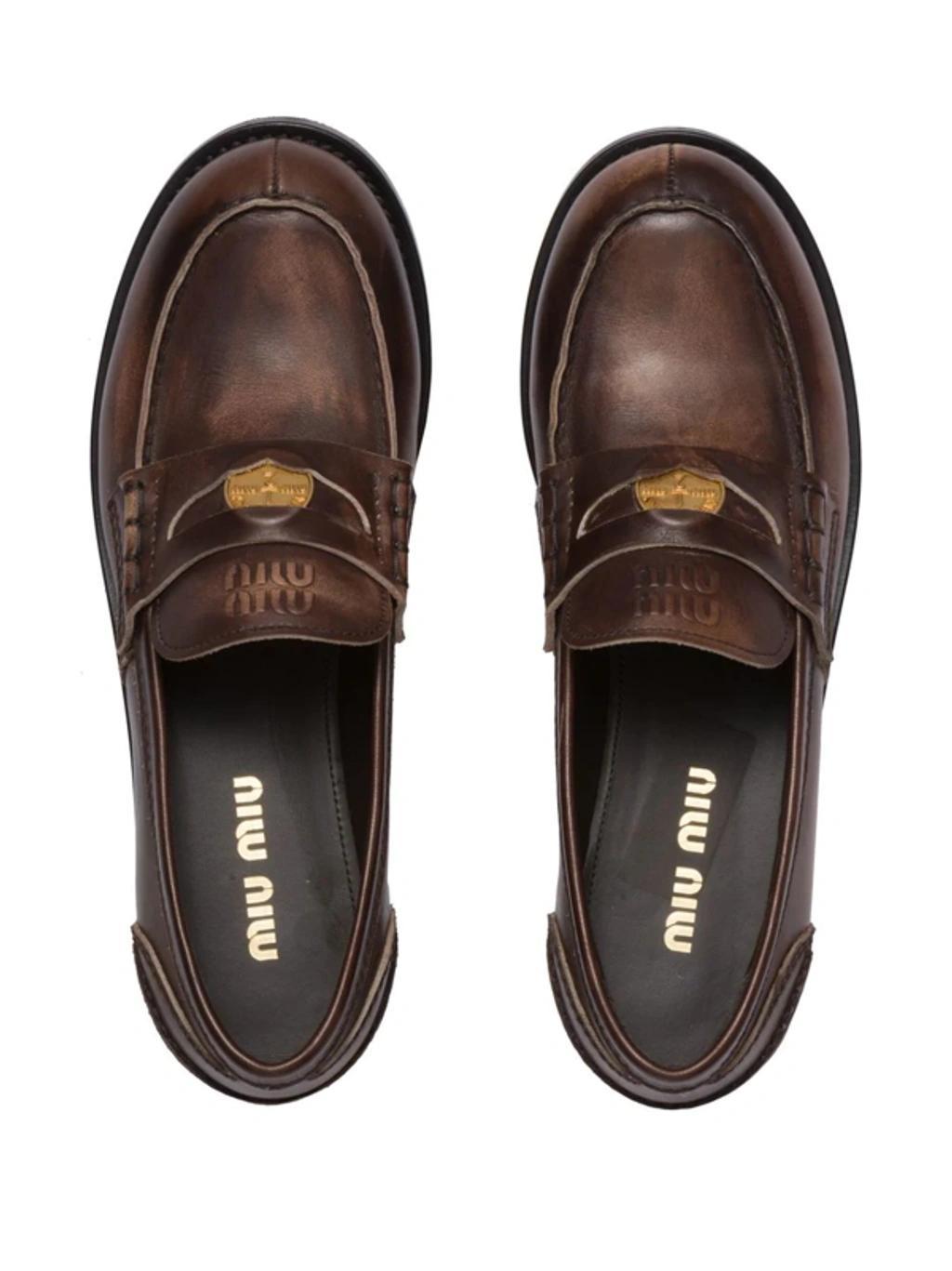 MIU MIU Leather Distressed Penny Loafers In Brown Product Image