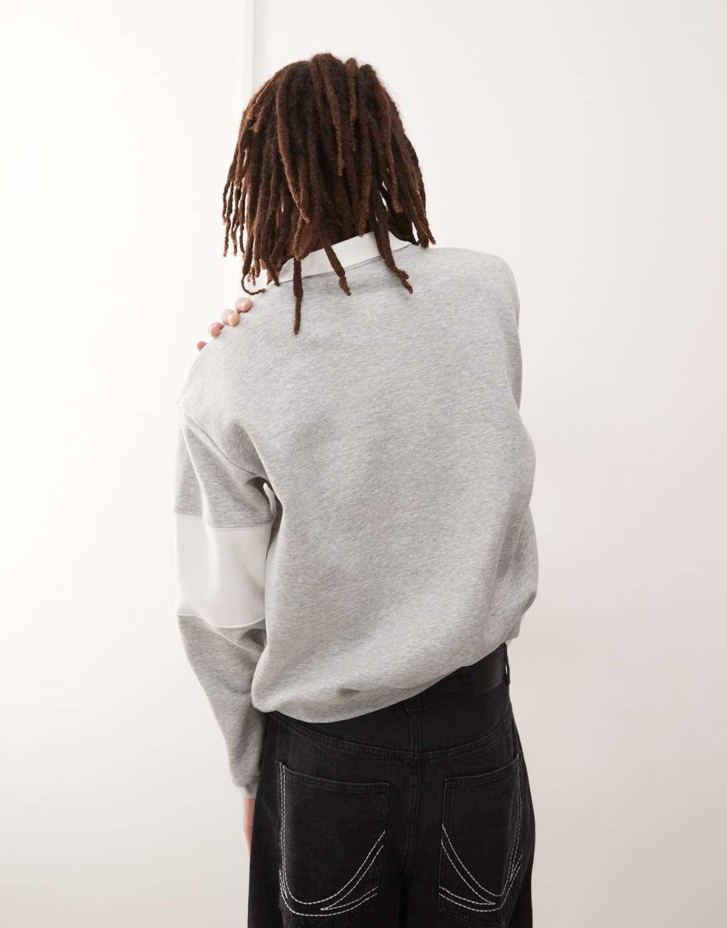 Weekday Andre oversized polo sweatshirt with cut and sew varsity graphic in gray melange Product Image
