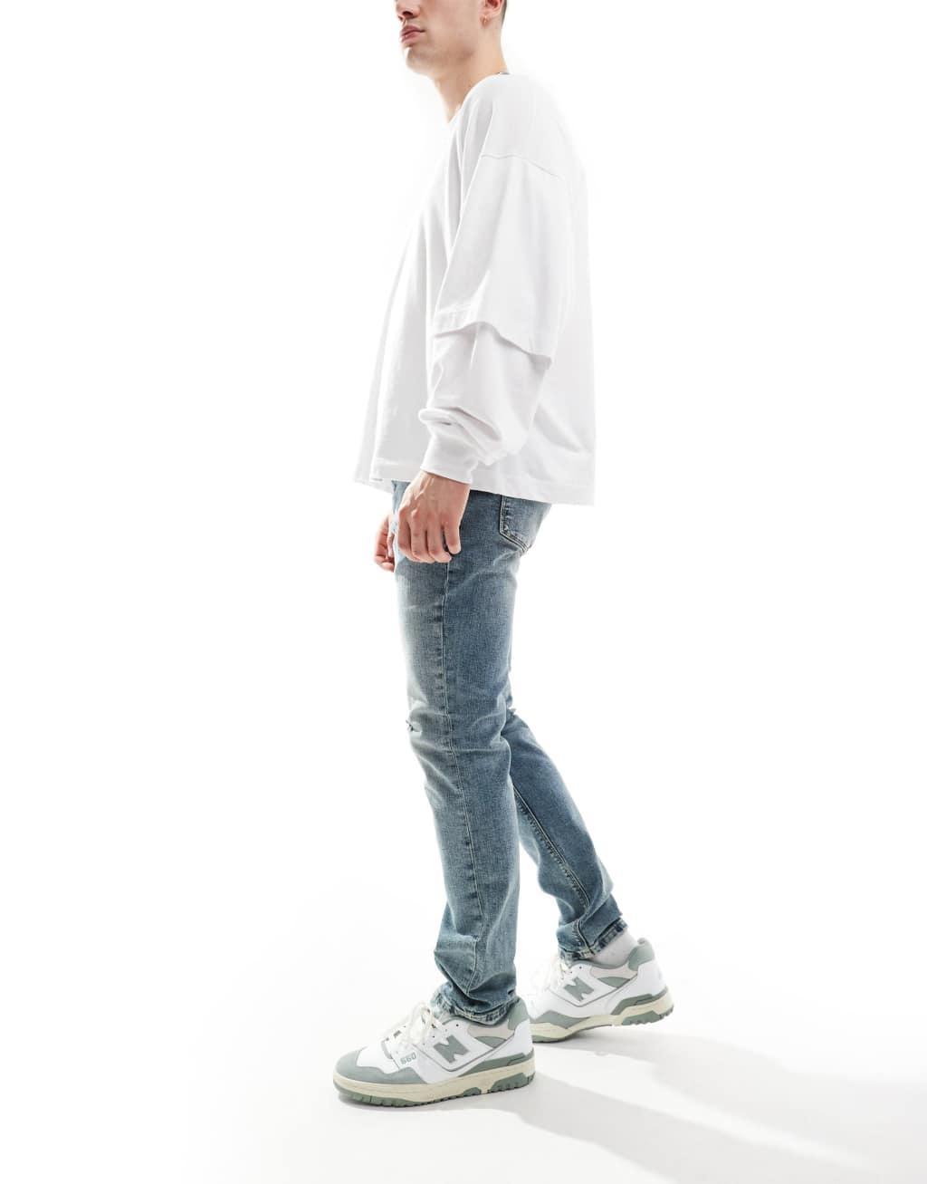 River Island skinny fit jeans in vintage midwash blue Product Image