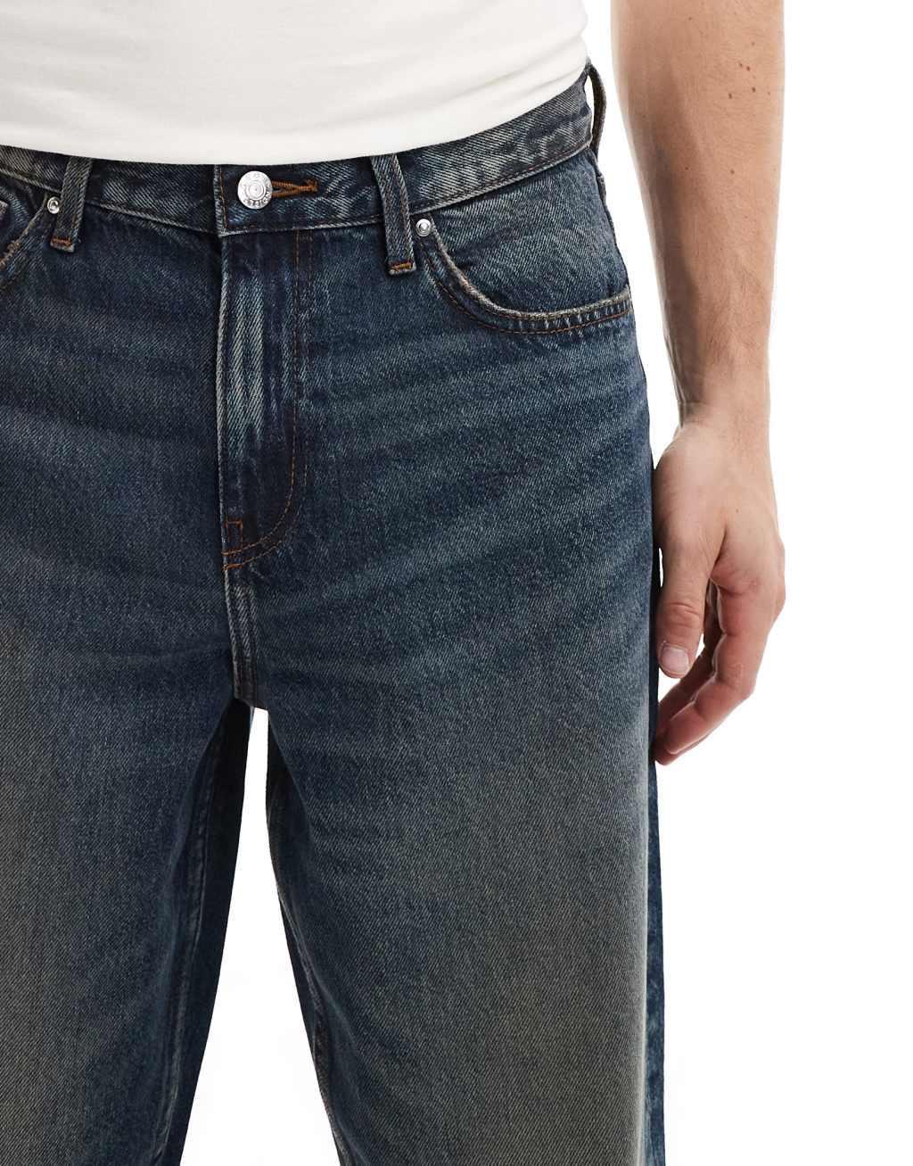 ASOS DESIGN baggy jeans in mid wash blue with heavy wash Product Image