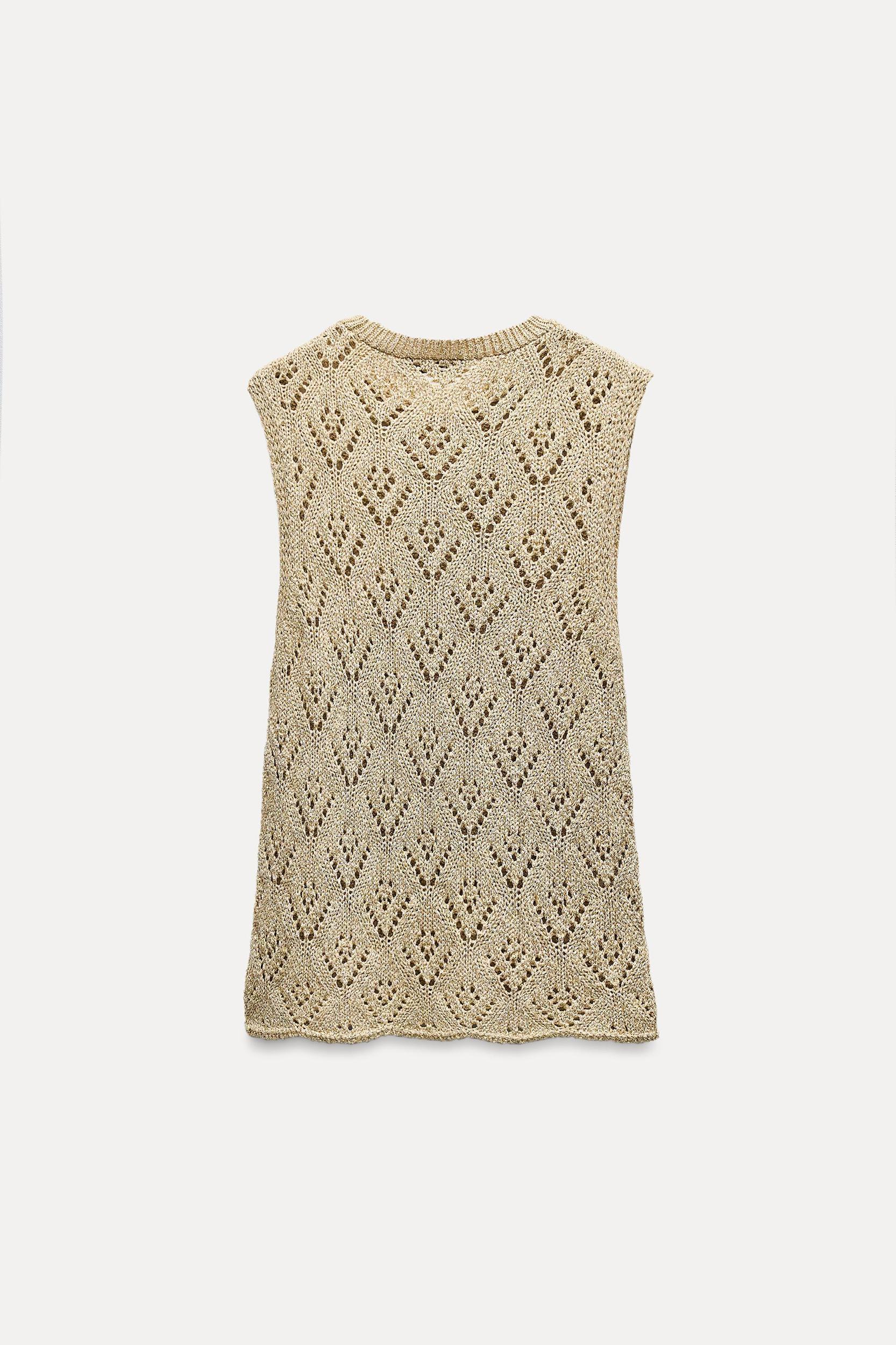 Round neck halter top. Knit fabric with openings and metallic thread. Product Image