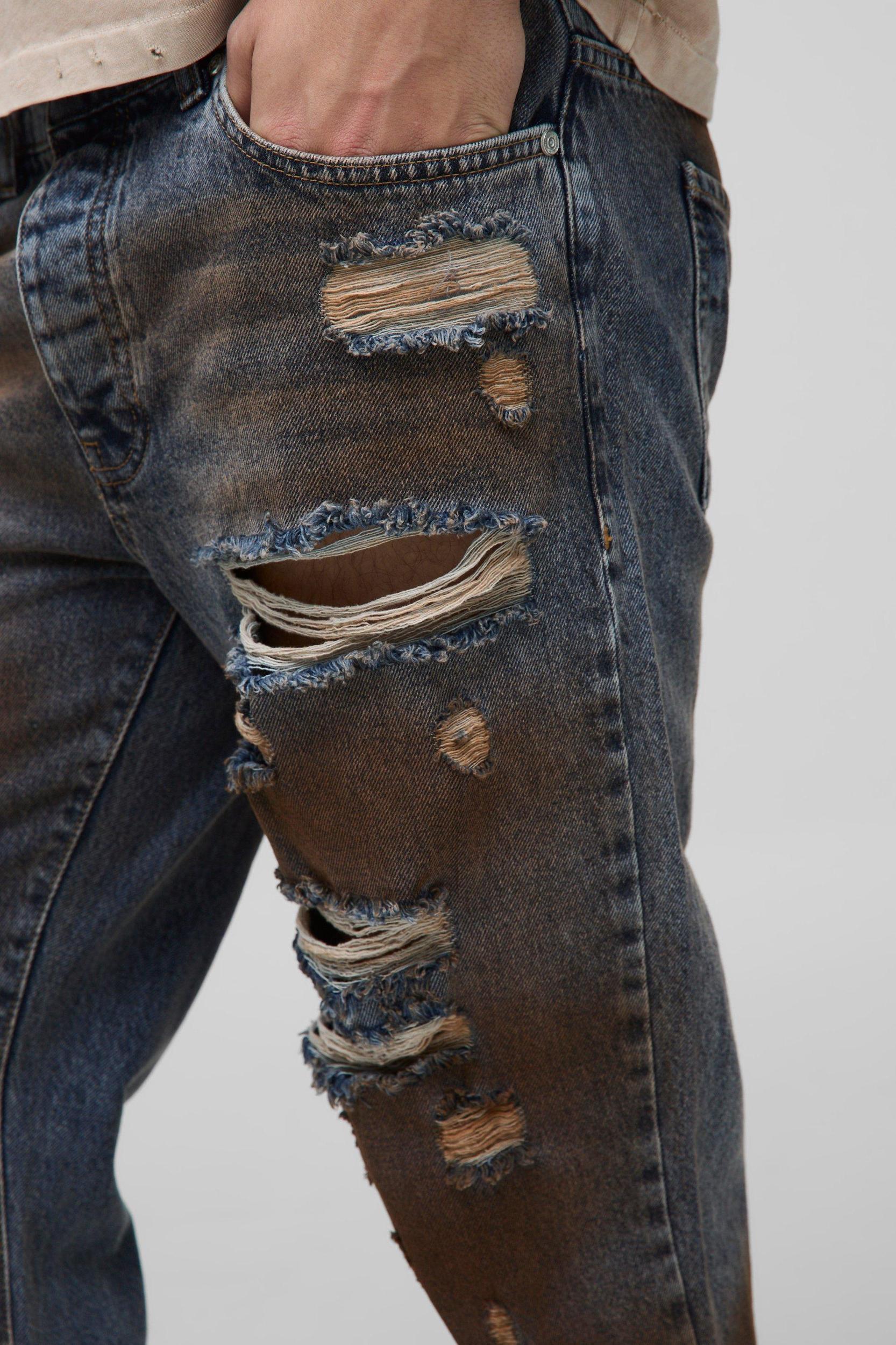 Slim Flared All Over Ripped Dirty Wash Jeans | boohooMAN USA Product Image