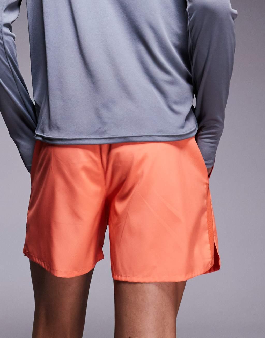Nike Running Challenger Dri-FIT 5 inch shorts in orange Product Image