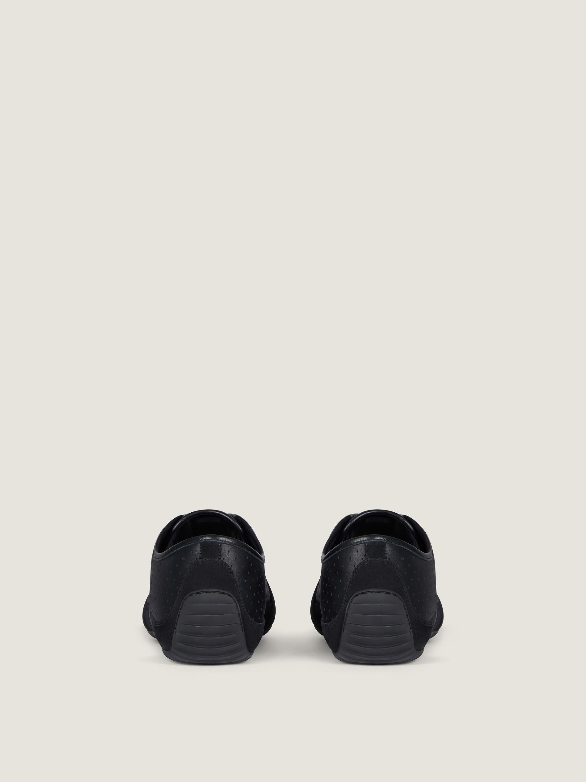 Slim sneakers in perforated leather and suede Product Image