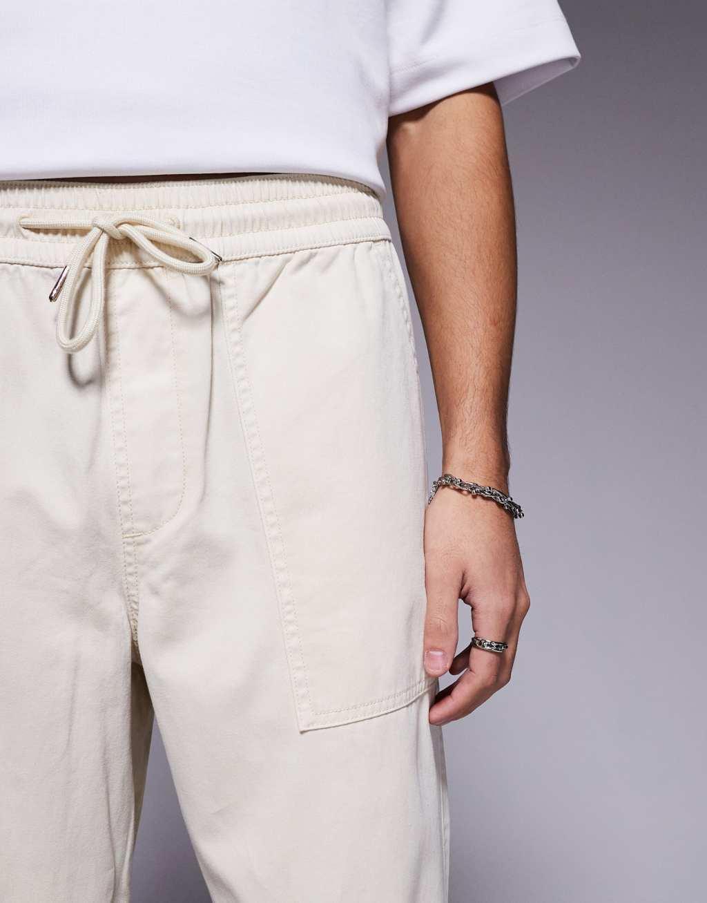ASOS DESIGN pull on pants with carpenter detailing in beige Product Image