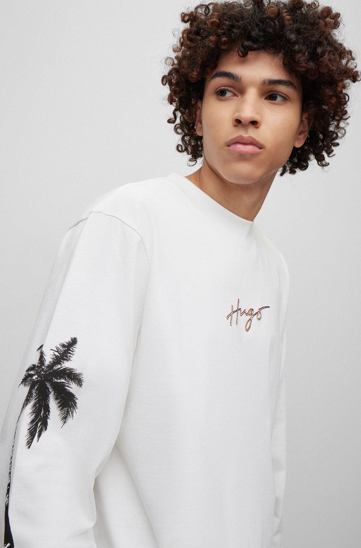 Cotton-jersey T-shirt with palm-tree artwork and branding Product Image