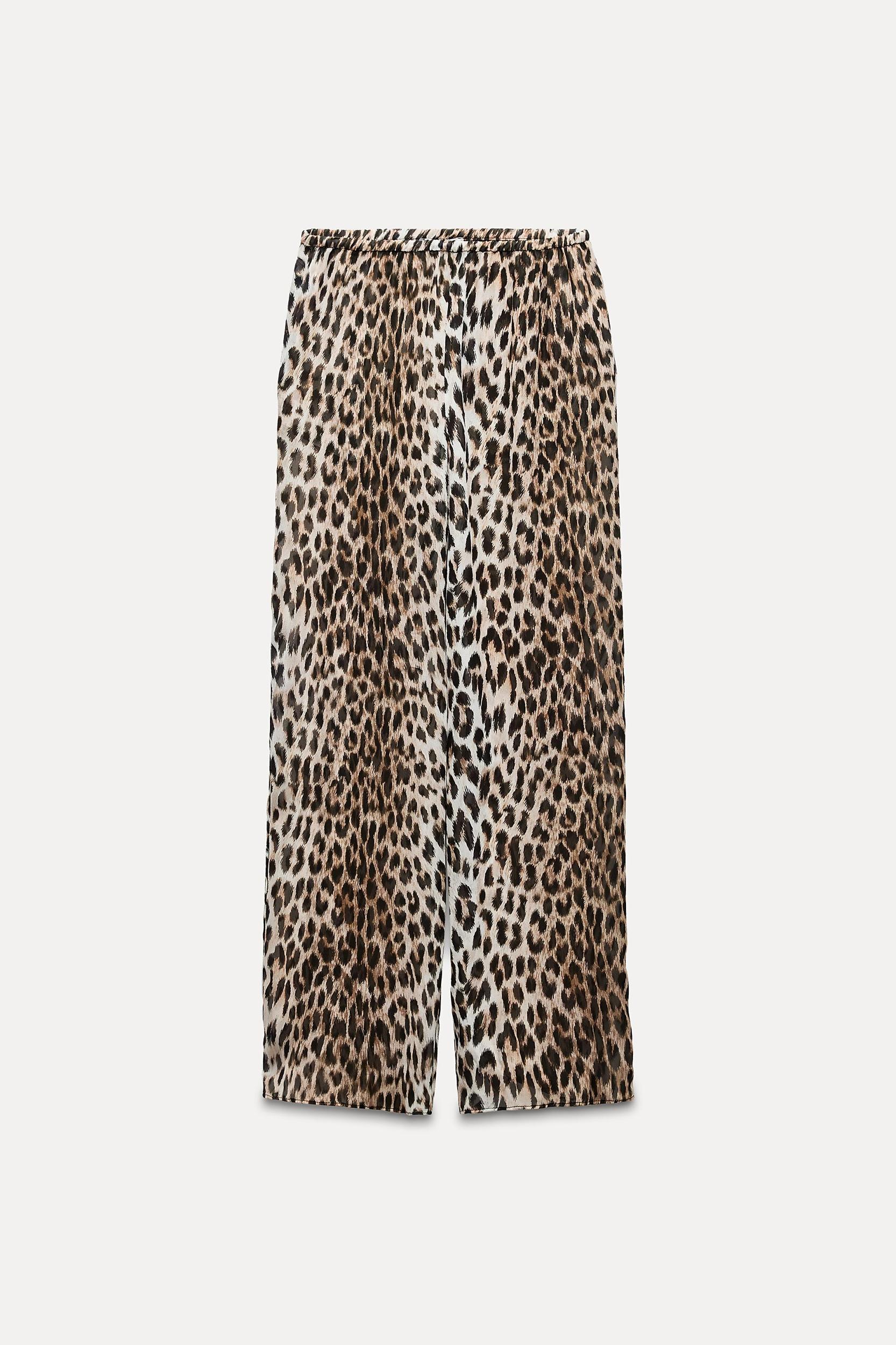 ZARA WOMAN COLLECTION<br/><br/>Pants made of 100% viscose.Mid-rise elastic waistband. Straight leg. Product Image