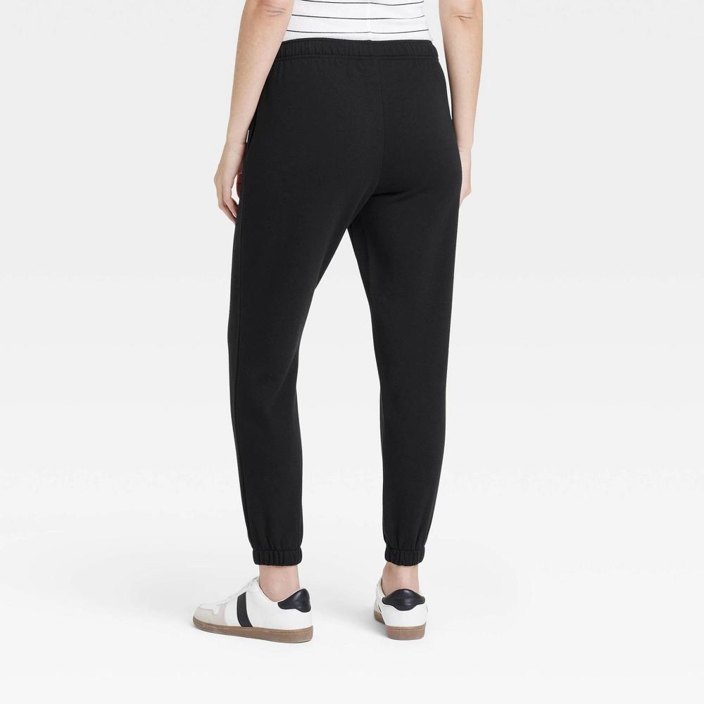 Women's Mid-Rise Essential Joggers - Universal Thread™ Black L: Cotton Blend, Side Pocket, Relaxed Leg, Knit Fleece Product Image