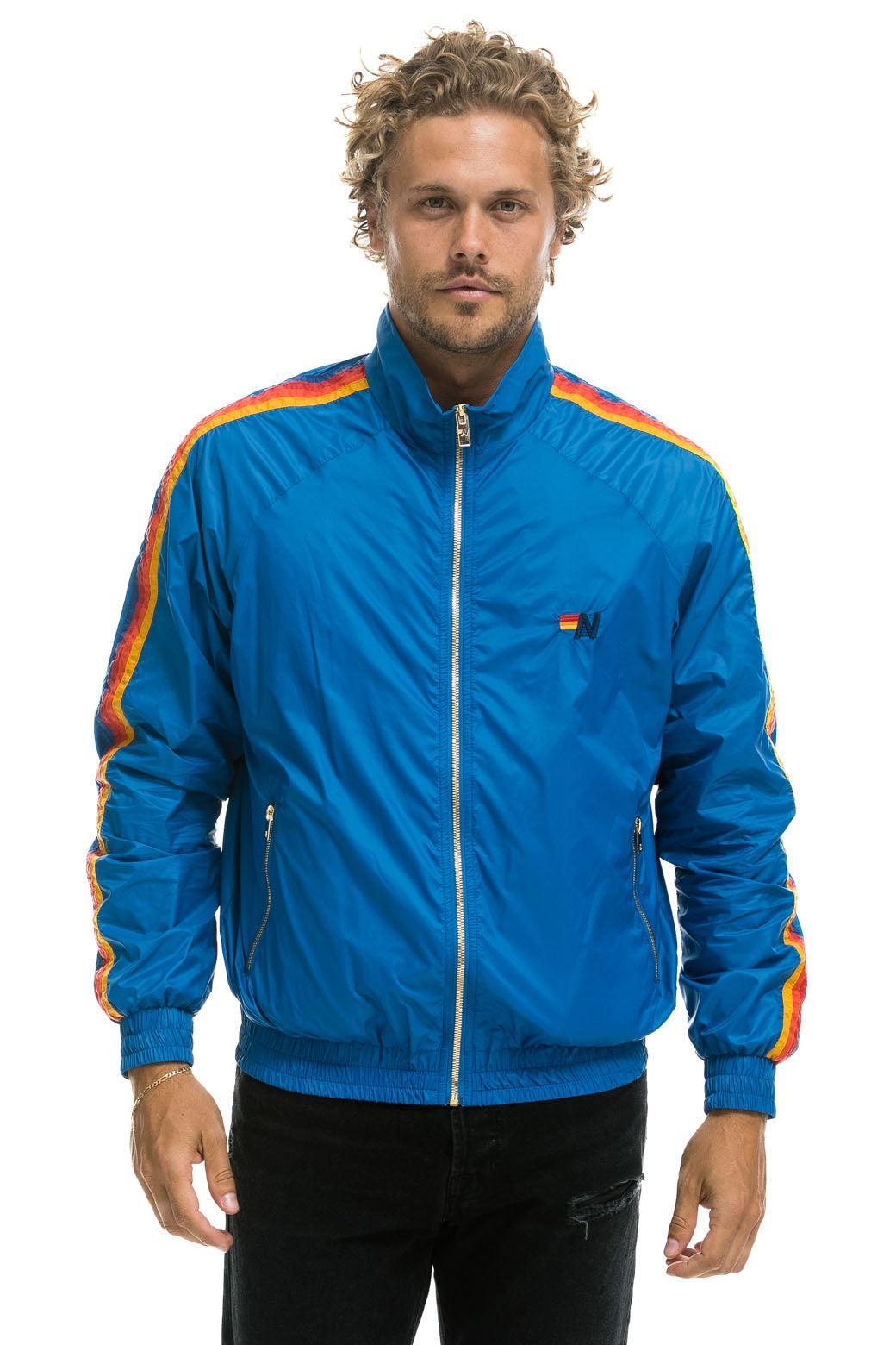 MEN'S 4 STRIPE WINDBREAKER -  SNORKEL BLUE Male Product Image