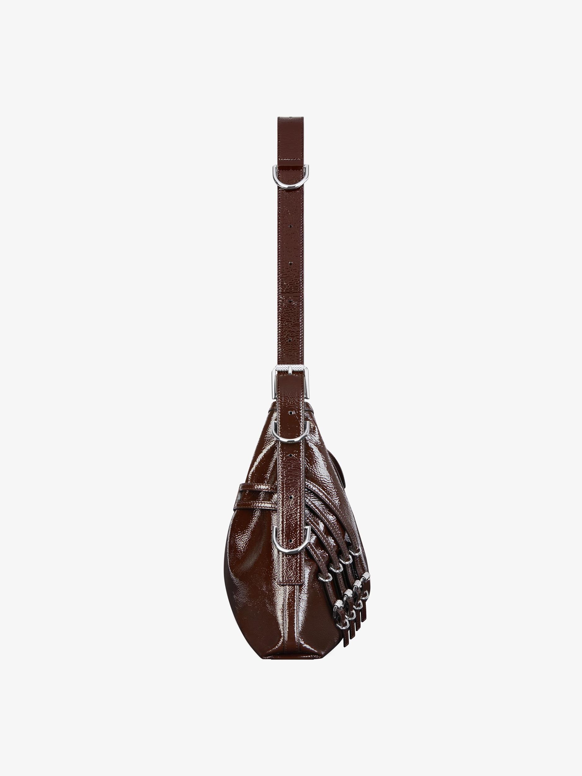 Medium Voyou bag in patent leather with multi-buckles Product Image