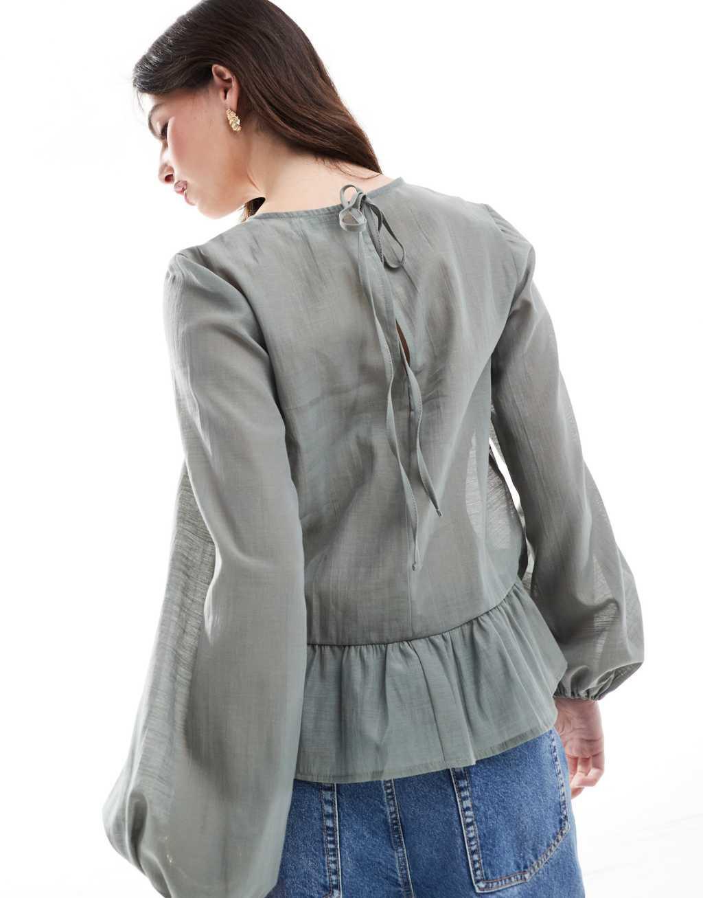 ASOS DESIGN long sleeve peplum hem top in green Product Image