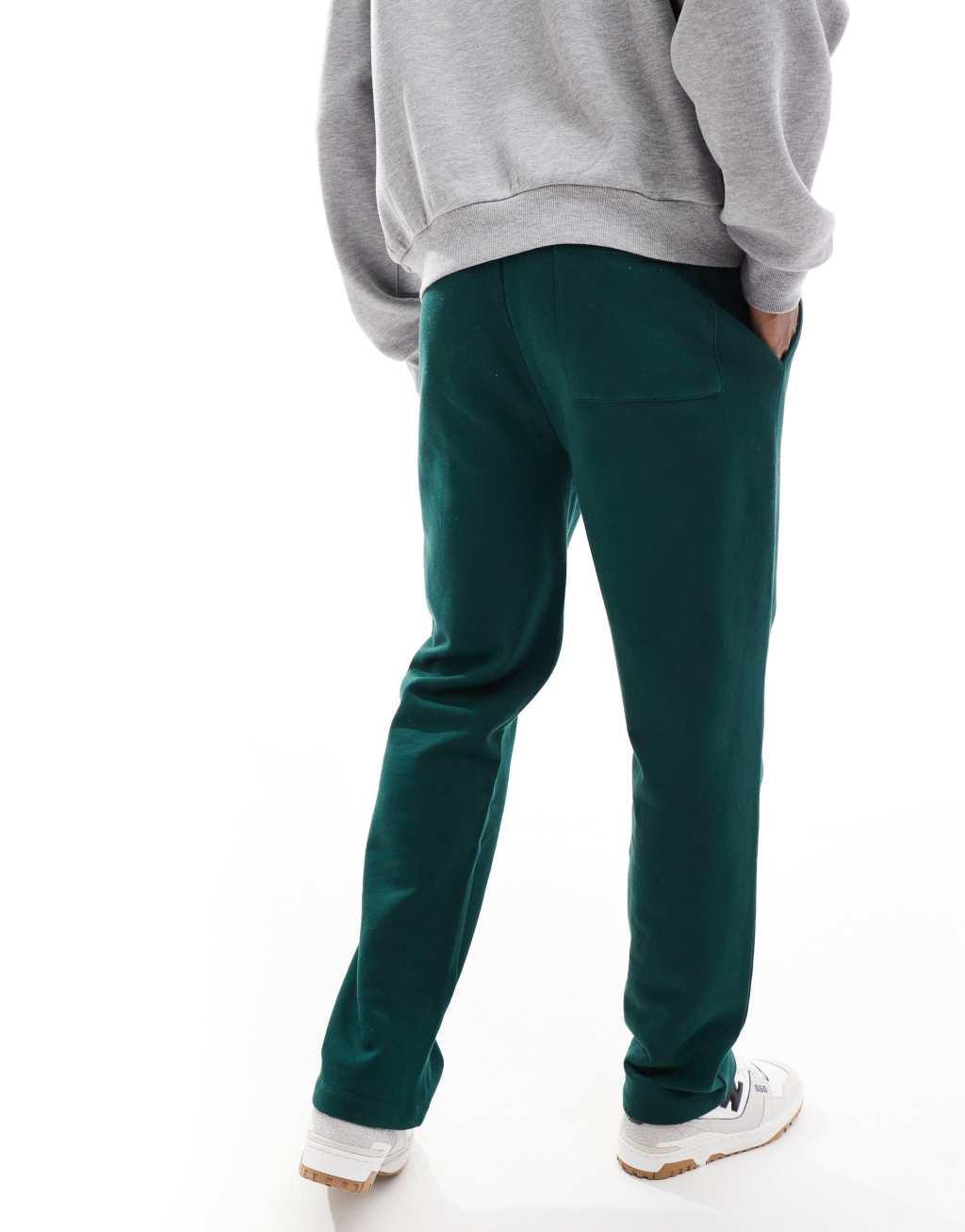 ASOS DESIGN straight leg sweatpants with Palermo print in green Product Image