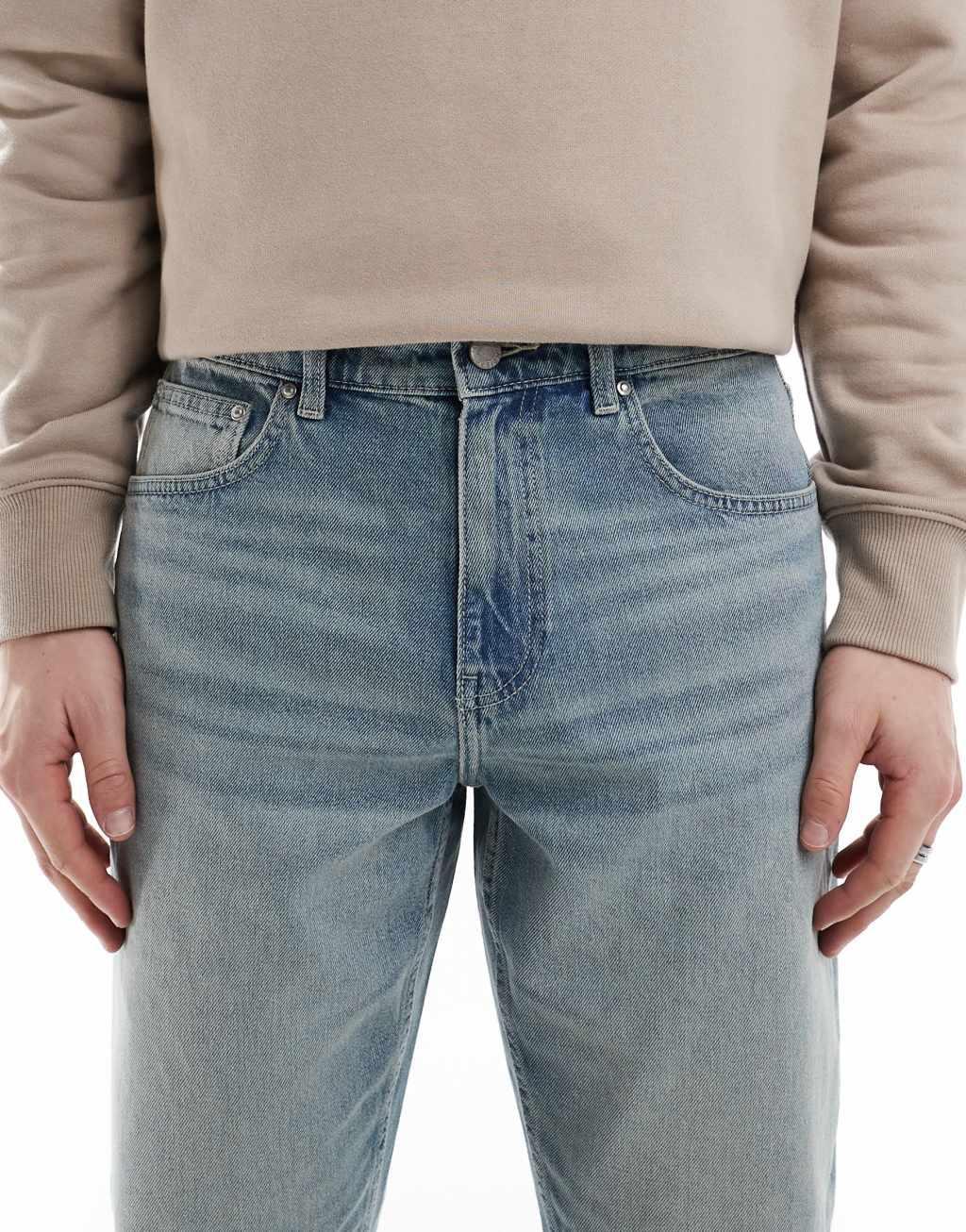 ASOS DESIGN tapered jeans in light wash blue  Product Image