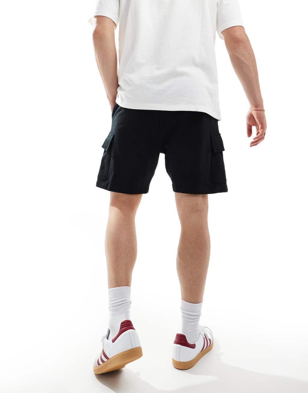 ASOS DESIGN slim shorts with cargo pocket in black Product Image