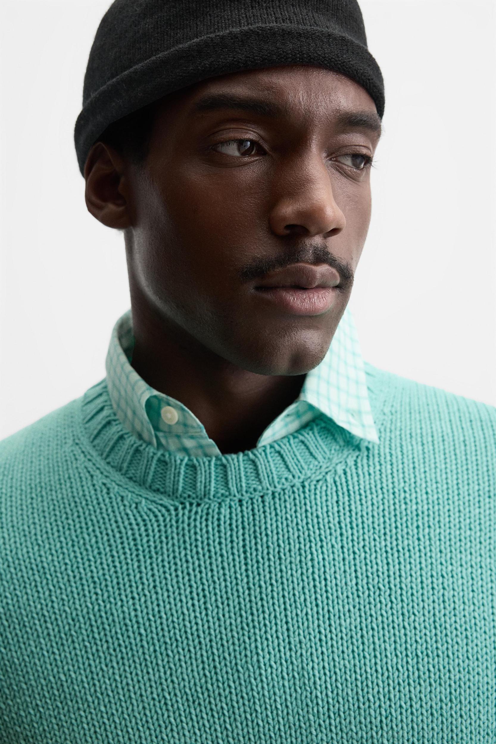 Relaxed fit cotton blend sweater. Round neck and long sleeves. Rib trim. Product Image