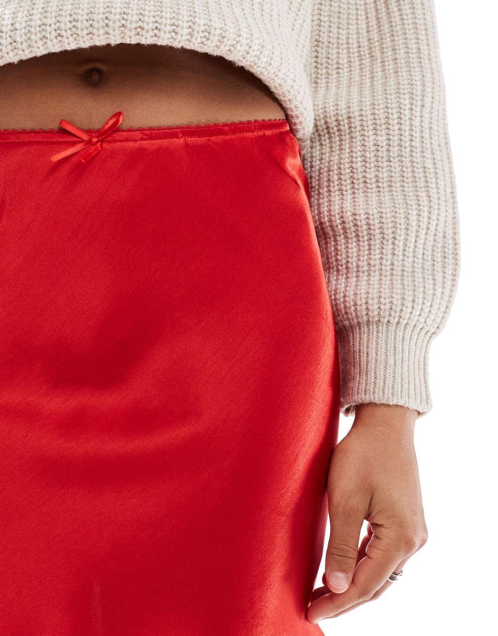 Miss Selfridge satin bias mini skirt with bow in red Product Image