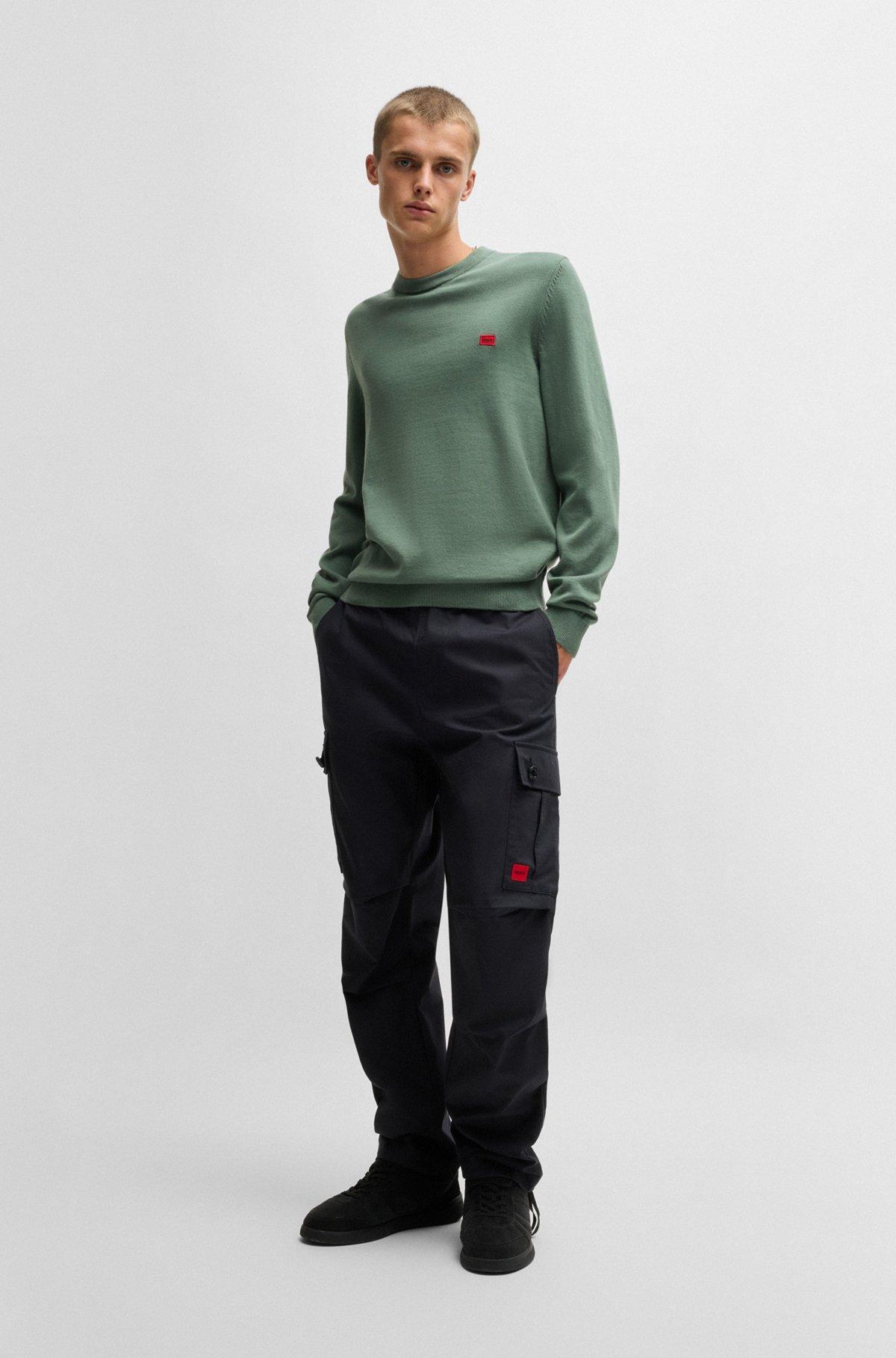 Knitted cotton sweater with red logo label Product Image