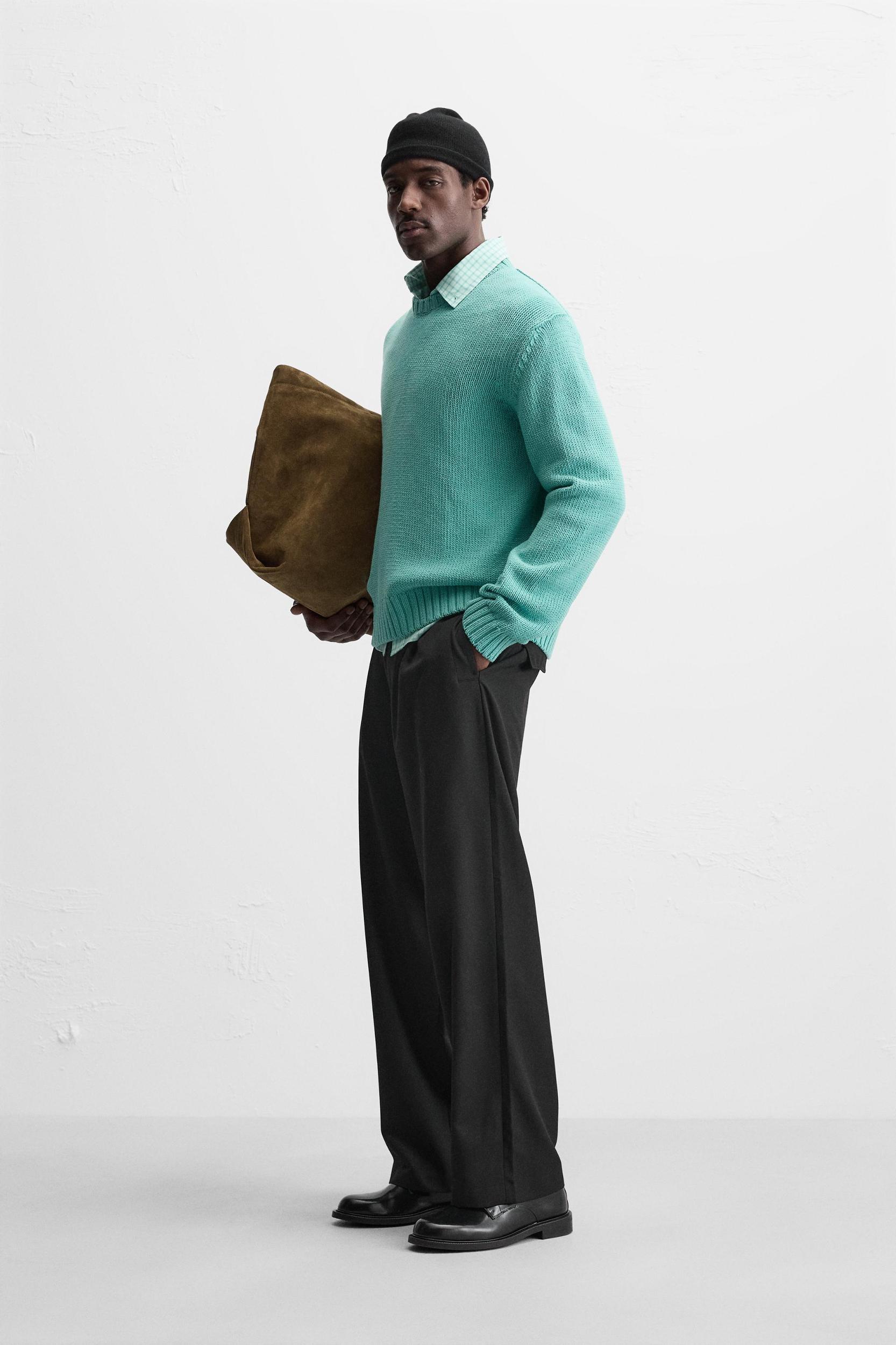 Relaxed fit cotton blend sweater. Round neck and long sleeves. Rib trim. Product Image