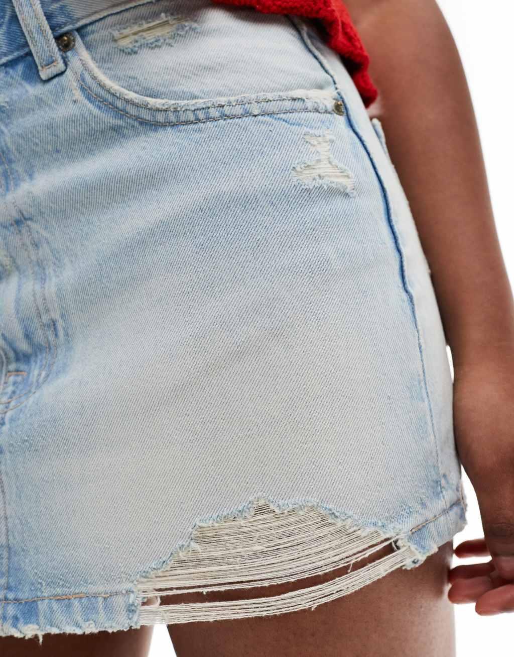 Pull&Bear distressed hem denim mini skirt in light blue Product Image