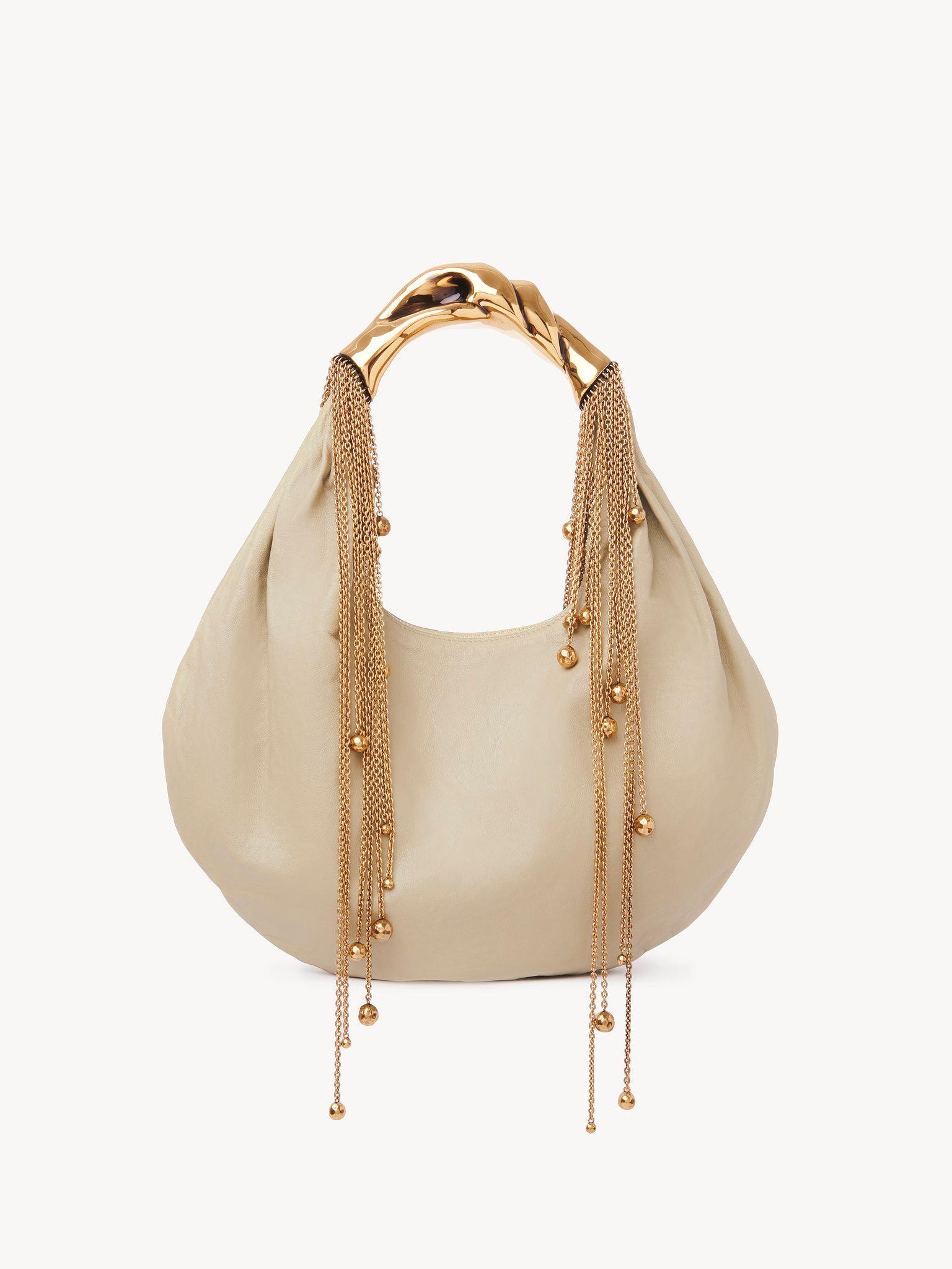 Twisted Shell hobo bag in shiny leather  Product Image