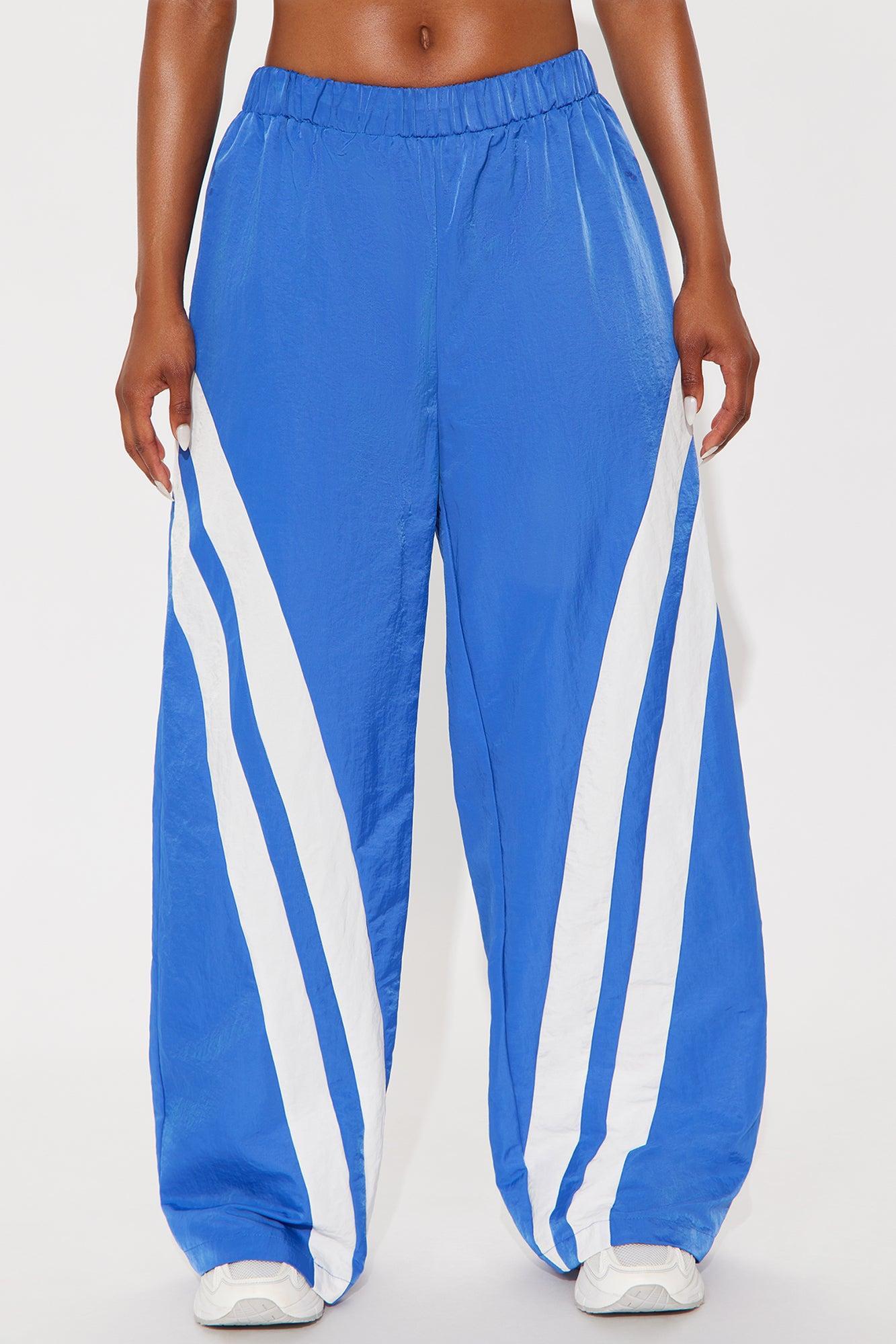 Follow The Curve Windbreaker Track Pant - Blue Product Image
