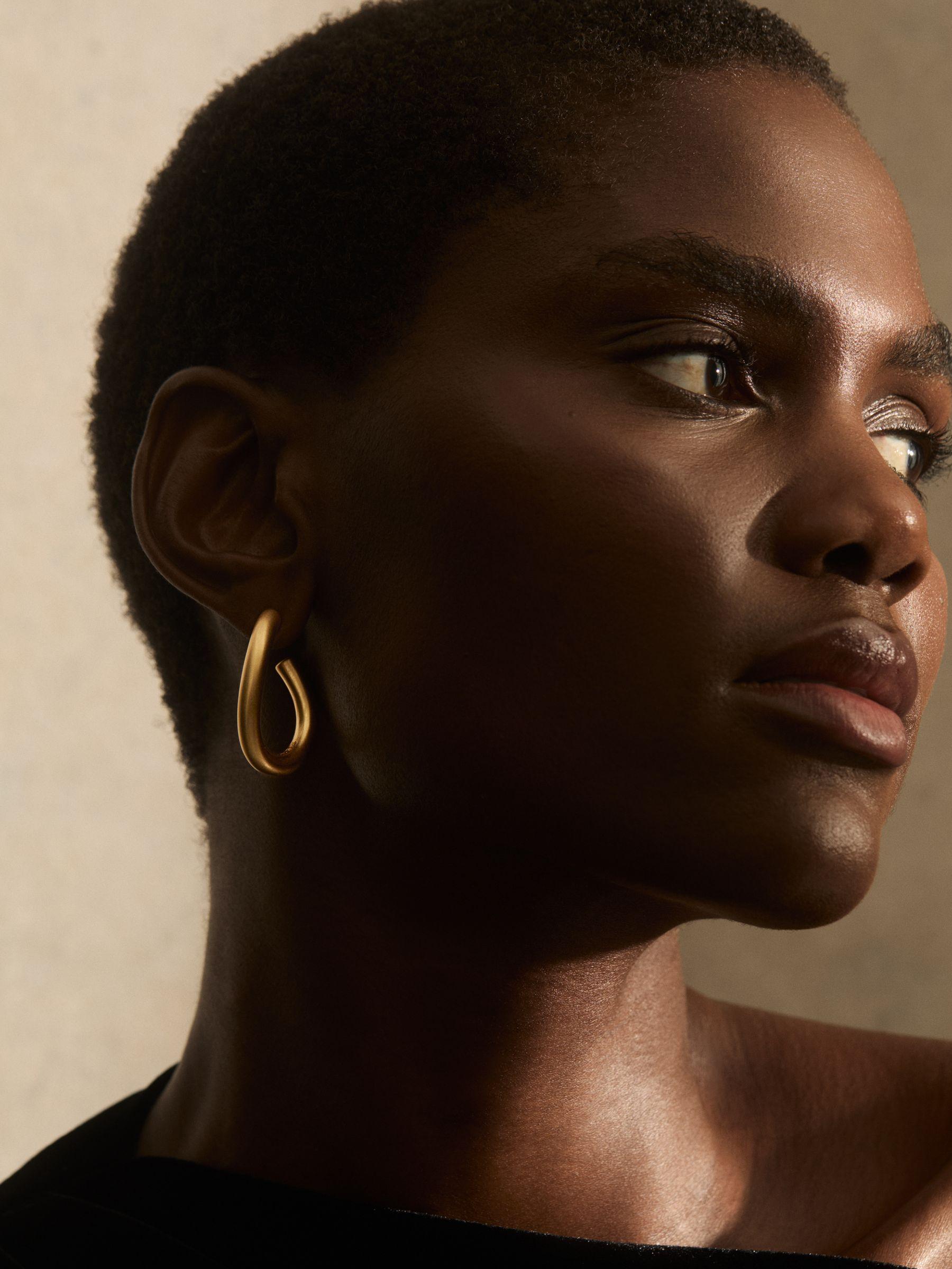 Wave Hoop Earrings in Gold Tone Product Image