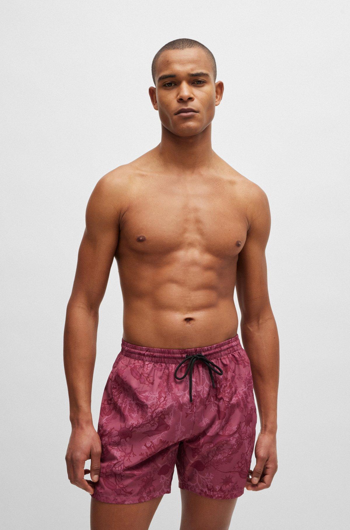 Logo-badge swim shorts with seasonal print Product Image