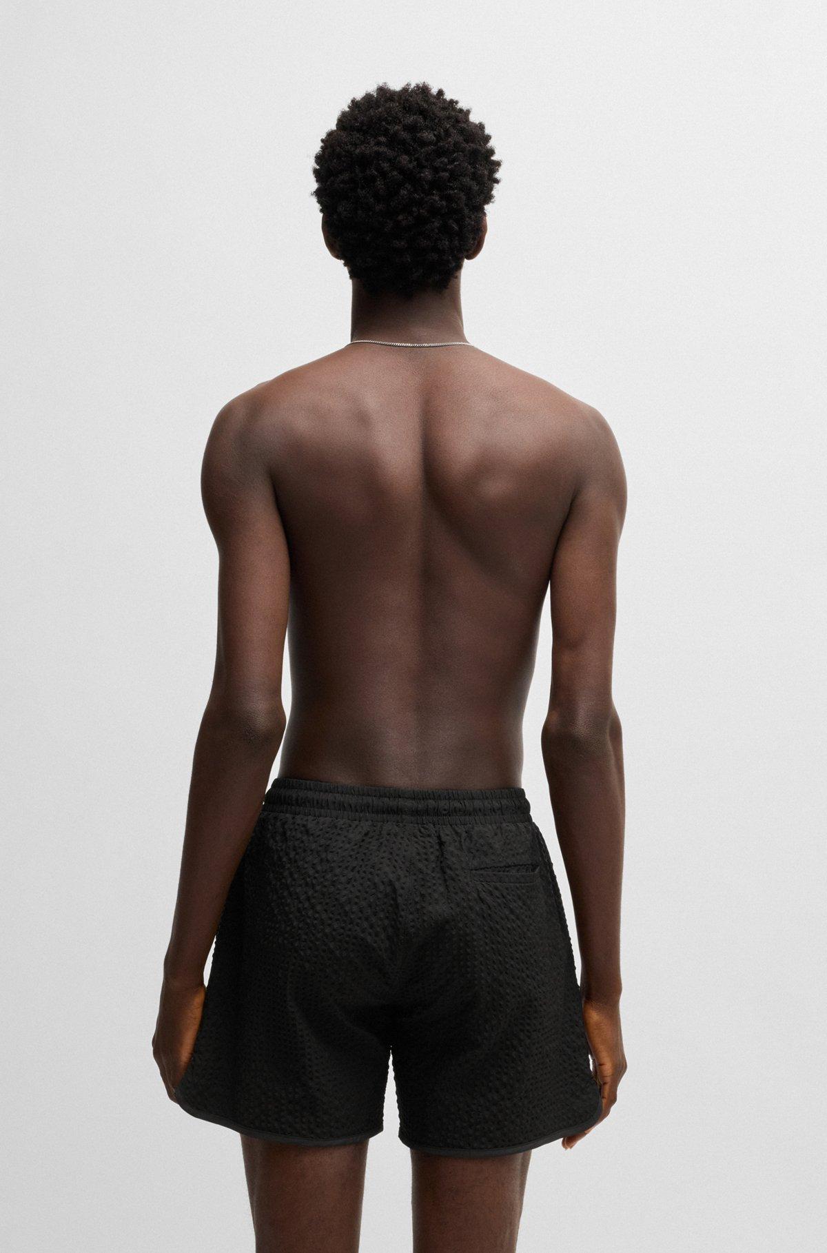 Waffle-structured swim shorts with embroidered stacked logo Product Image