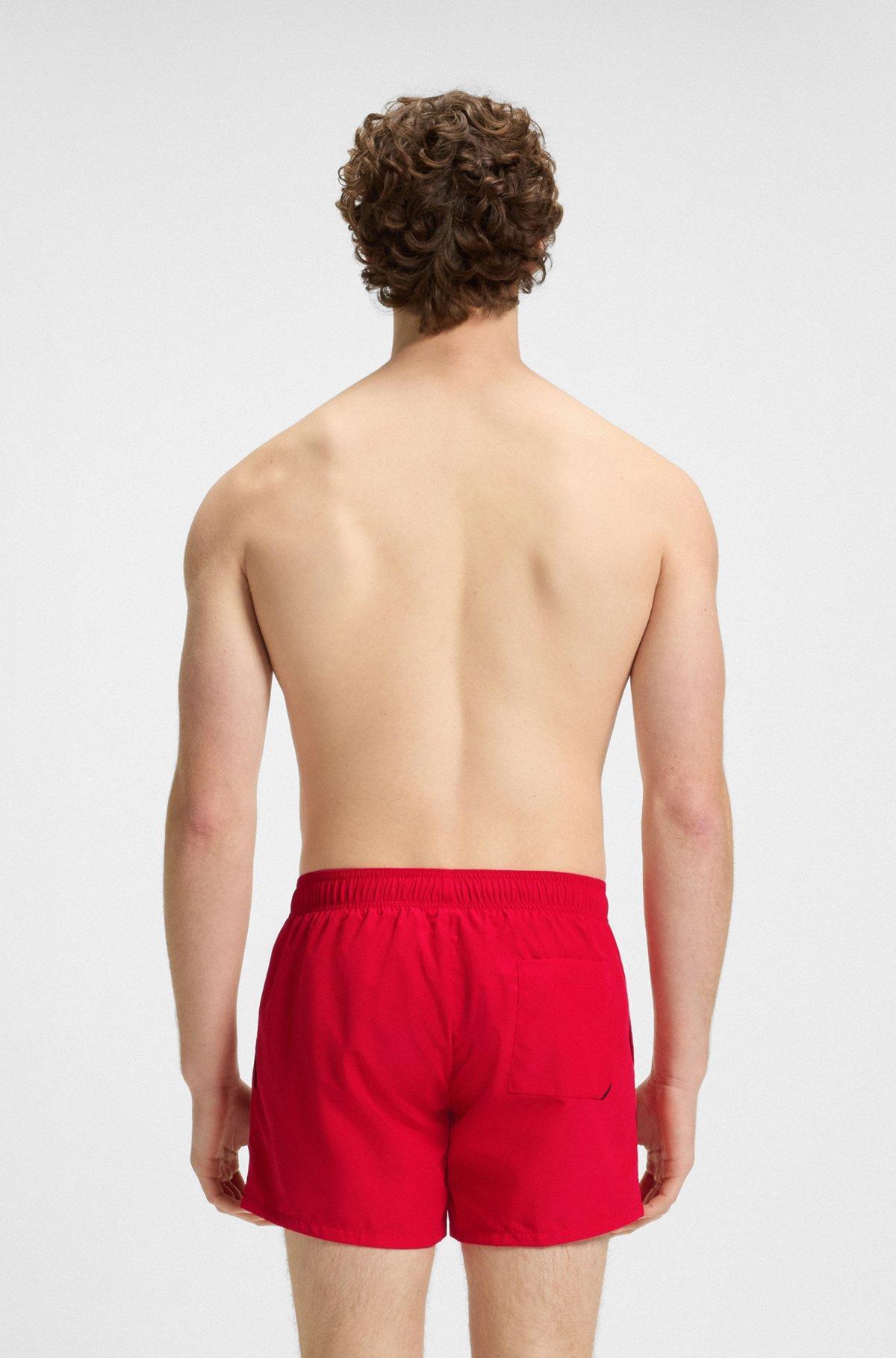 HUGO - Quick-dry swim shorts with vertical logo print - light pink Product Image