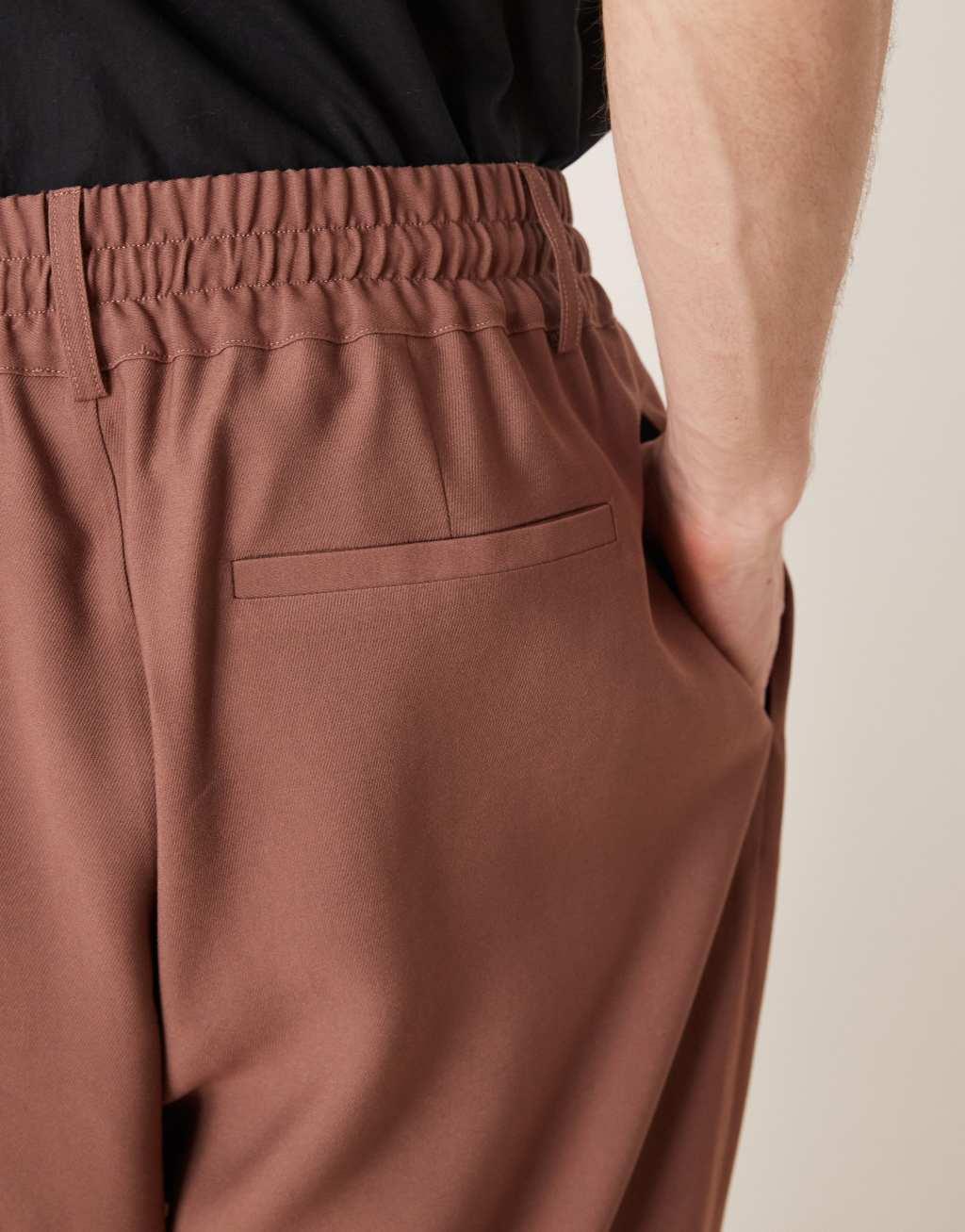 ASOS DESIGN loose fit smart pants with wide waistband and elasticated waist in brown Product Image