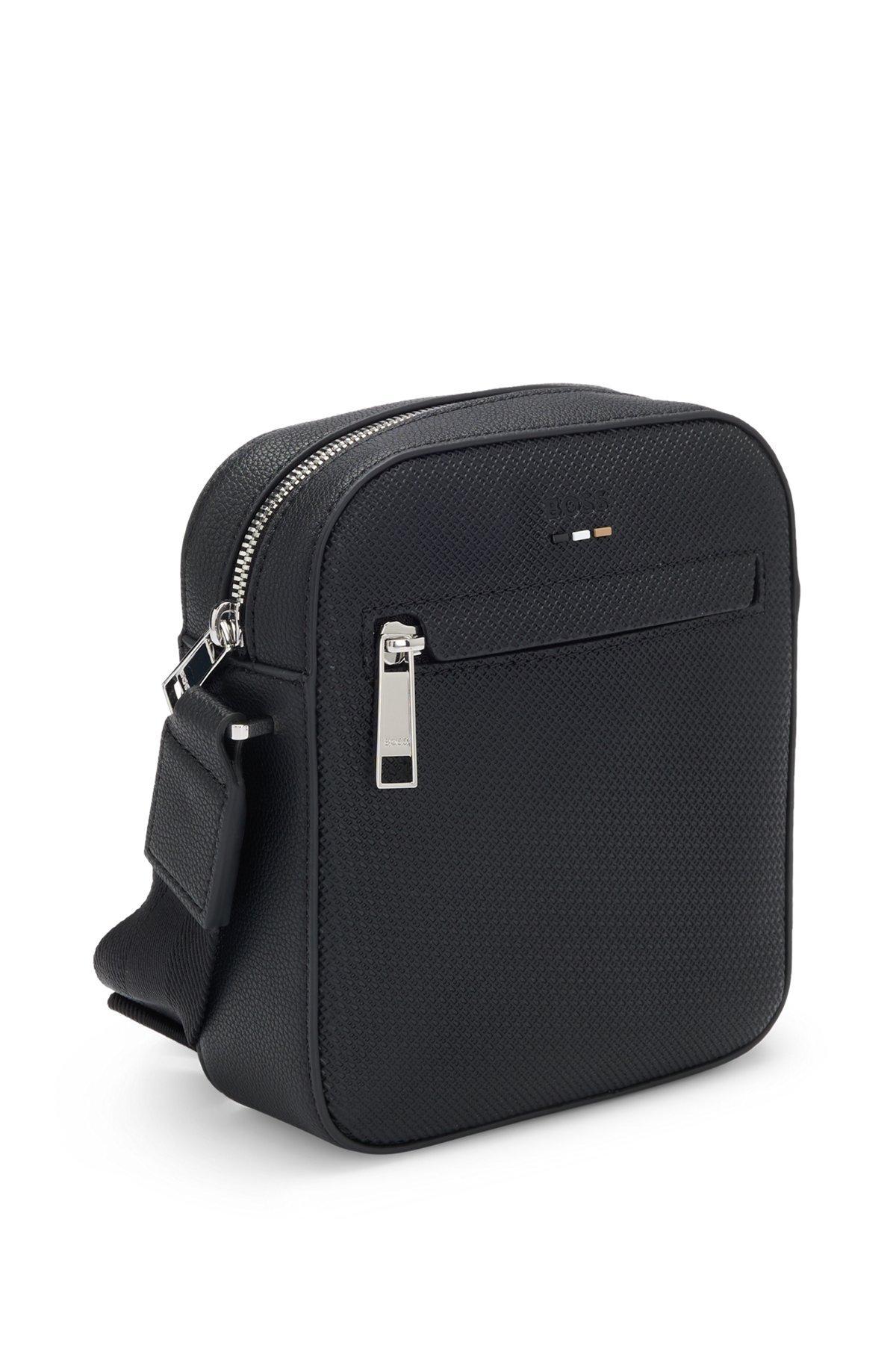 Reporter bag in faux leather with monogram-embossed panels Product Image