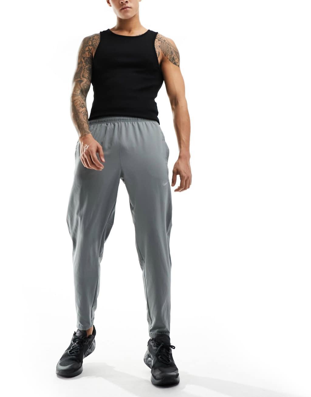 Nike Running Challenger woven sweatpants in gray Product Image