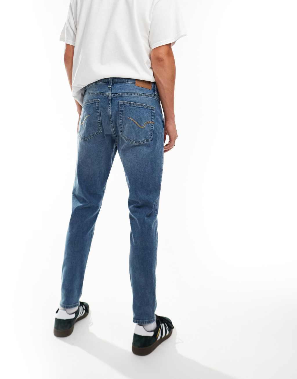 ONLY & SONS slim tapered fit jeans in mid blue wash Product Image