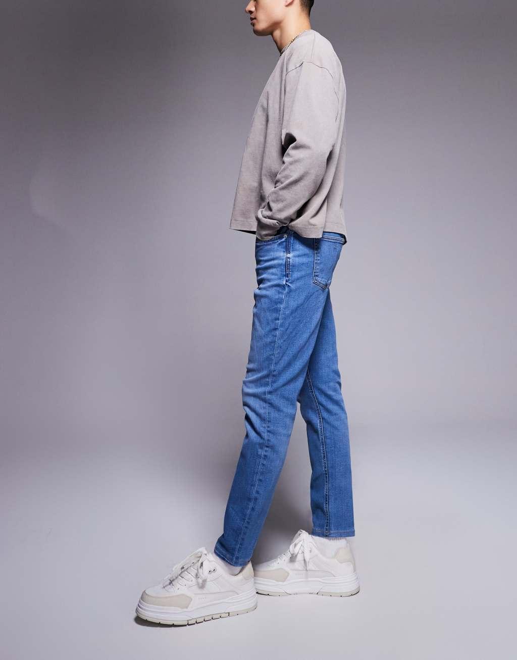 River Island slim fit jeans in medium blue Product Image