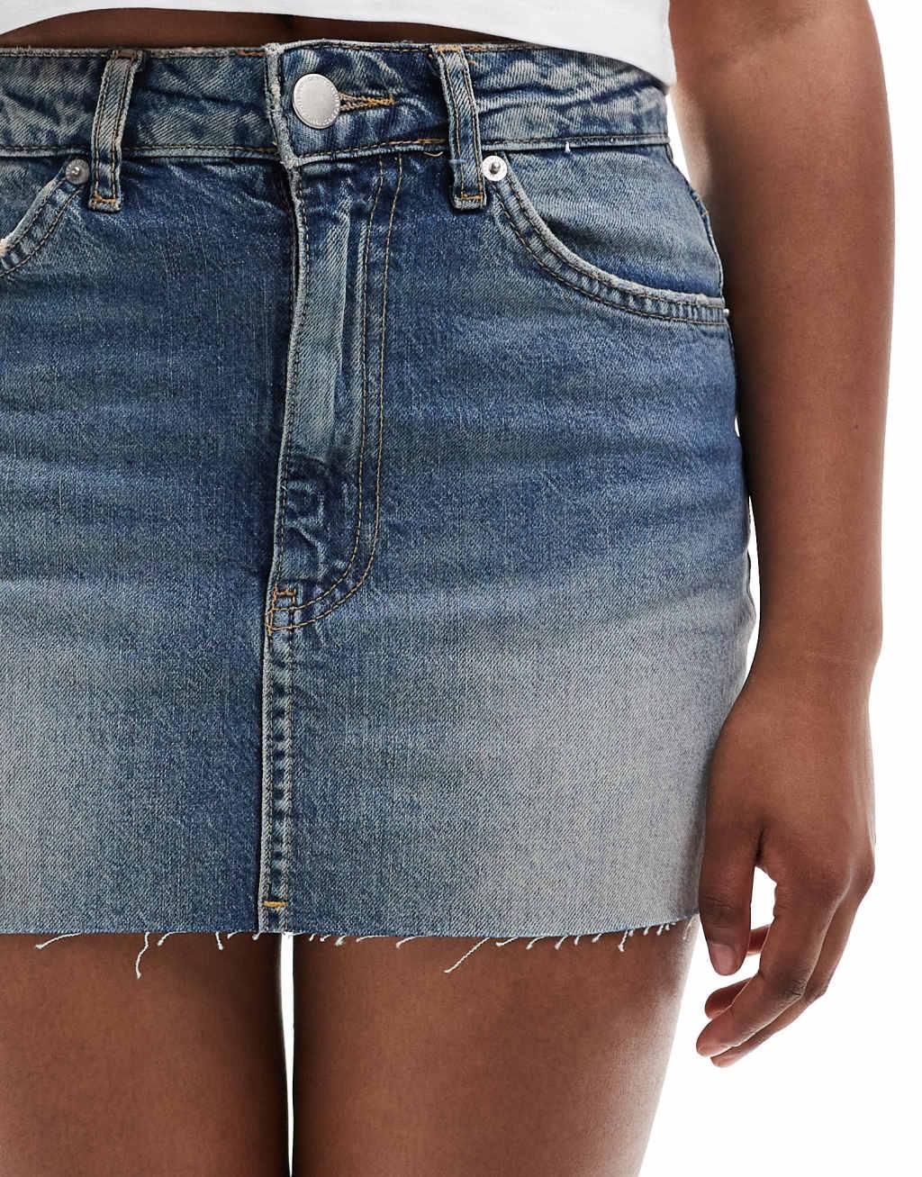 Pull&Bear raw hem denim mini skirt in washed blue Product Image