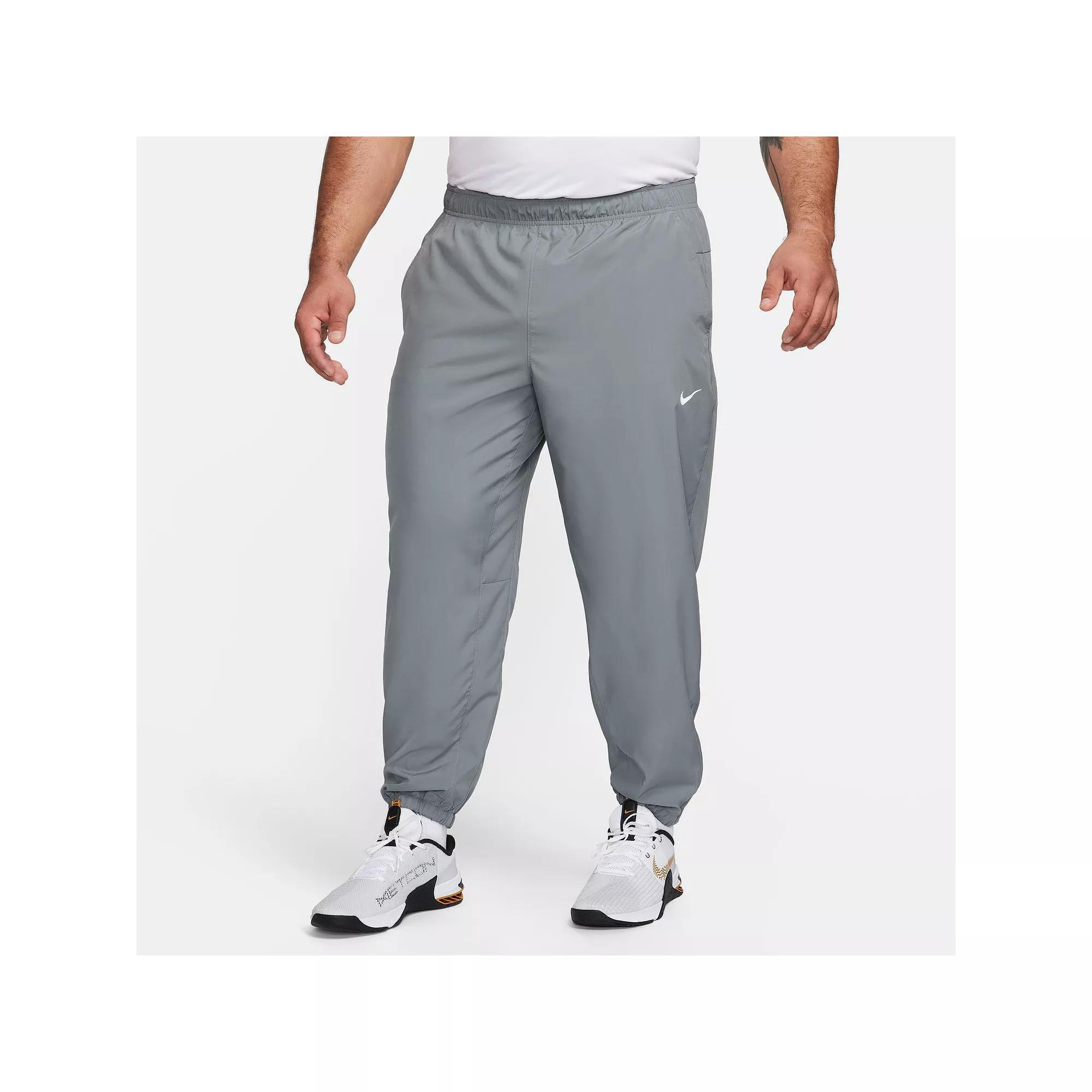 Nike Men's Form Dri-FIT Tapered Versatile Pants in Grey/Smoke Grey Size Large 100% Polyester Product Image