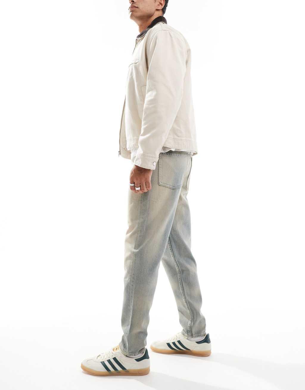 ASOS DESIGN tapered jeans in light wash with tint Product Image