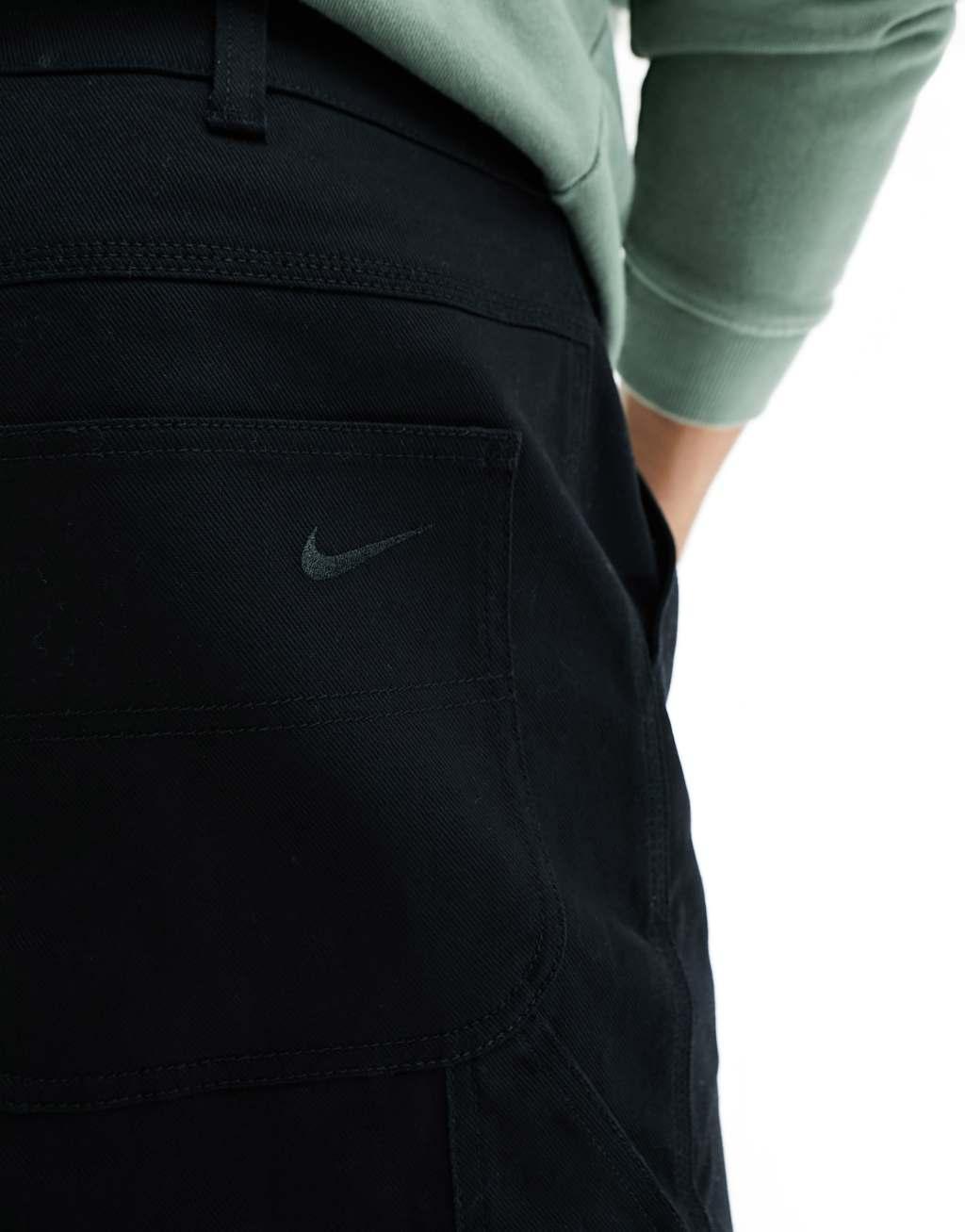 Nike Life Carpenter pants in black Product Image