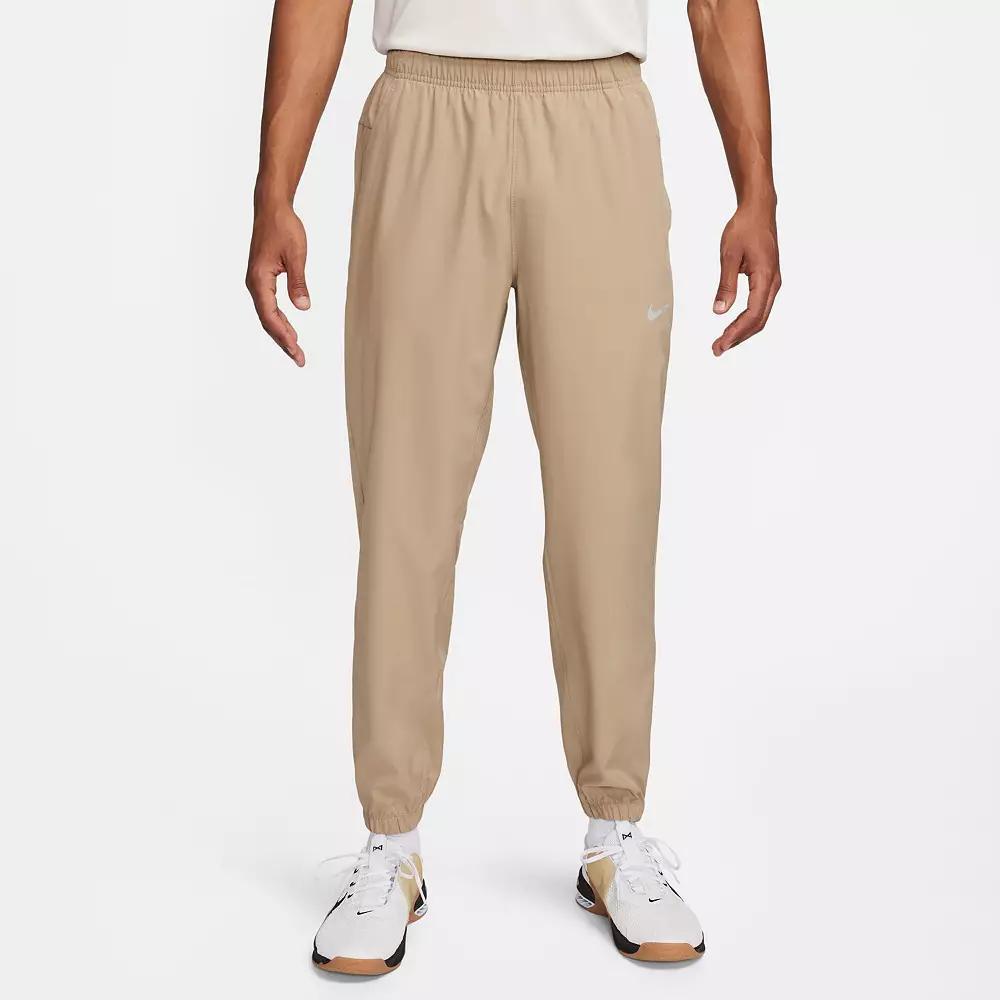 Nike Men's Form Dri-FIT Tapered Versatile Pants in Grey/Smoke Grey Size Large 100% Polyester Product Image