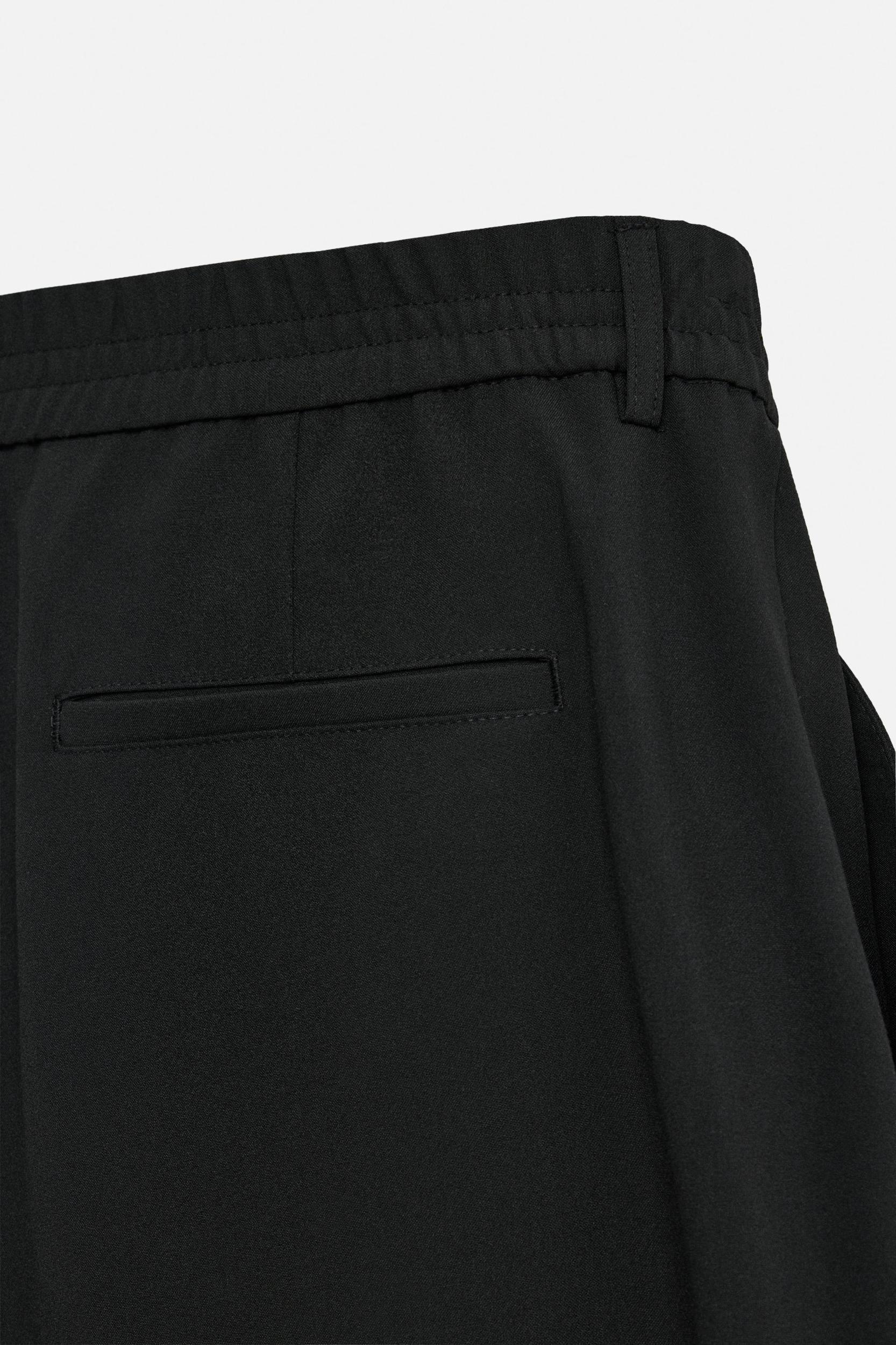 PLEATED WIDE FIT PANTS Product Image